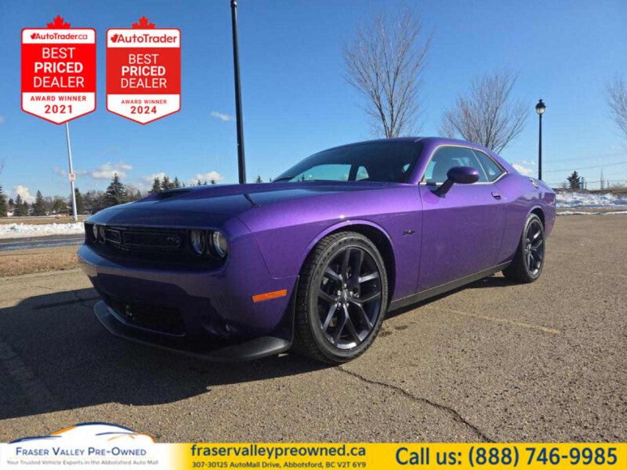 Fraser Valley Pre-Owned is thrilled to present this stunning 2023 Dodge Challenger R/T, a true standout that is sure to turn heads wherever you go! This beauty rolls out of the factory with the absolute best spec you can get for an R/T, showcasing the ultra-desirable Plum Crazy Pearl paint color paired with an upgraded Nappa Leather /Alcantera-faced black leather interior.
 
This V8 Hemi Challenger is a collector’s dream, especially now that the legendary V8 Hemi engine has been awarded a full Honorable Discharge to make way for the electric engine Challengers (sounds weird, we know).
 
This Challenger is in brand new showroom condition and comes loaded with a stacked feature list:
 
BlackTop Package: Enhances the bold aesthetic with blacked-out accents.
Plus Package Features: 
- Nappa leather ventilated and cooled seats
- heated seats
- heated steering wheel
- power steering wheel
- blind-spot monitoring with rear cross-path detection.
Tech Package:
- Auto High-Beam headlights
- forward collision warning (insurance discount!)
- adaptive cruise control 
Harman/Kardon Sound Package: An 18-speaker audio system that sounds like your own personal orchestra, delivering an unparalleled audio experience.
Power Sunroof
Navigation Package: Find your way with ease, even on the most adventurous trips.
Apple CarPlay and Android Auto: Seamlessly integrate your smartphone for easy access to apps and navigation.
+ much, much, more!
 
This 2023 Dodge Challenger R/T is not just a car; its an experience that embodies power and style. Don’t miss your chance to own this exceptional vehicle! Contact our Sales and Finance team or apply for Pre-Approval today, and let’s get you behind the wheel of this extraordinary Challenger!
 To view the original window sticker for this vehicle view this http://www.chrysler.com/hostd/windowsticker/getWindowStickerPdf.do?vin=2C3CDZBT0PH682515. 

 
To apply right now for financing use this link : https://www.fraservalleypreowned.ca/abbotsford-car-loan-application-british-columbia
 
 

| Our Quality Guarantee: We maintain the highest standard of quality that is required for a Pre-Owned Dealership to operate in an Auto Mall. We provide an independent 360-degree inspection report through licensed 3rd Party mechanic shops. Thus, our customers can rest assured each vehicle will be a reliable, and responsible purchase.  |  Purchase Disclaimer: Your selected vehicle may have a differing finance and cash prices. When viewing our vehicles on third party  marketplaces, please click over to our website to verify the correct price for the vehicle. The Sale Price on third party websites will always reflect the Finance Price of our vehicles. If you are making a Cash Purchase, please refer to our website for the Cash Price of the vehicle.  | All prices are subject to and do not include, a $995 Finance Fee, and a $995 Document Fee.   These fees as well as taxes, are included in all listed listed payment quotes. Please speak with Dealer for full details and exact numbers.  o~o