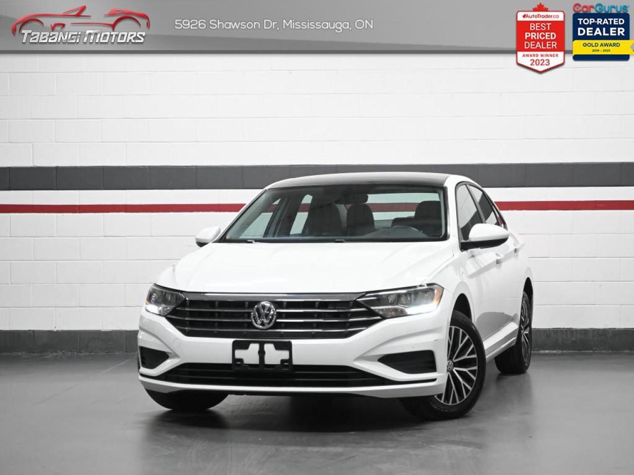 <b>Apple Carplay, Android Auto, Navigation, Sunroof, Heated Seats, Blind Spot, Rear Traffic Alert, Push Button Start, Keyless Entry! Former Daily Rental!</b><br>  Tabangi Motors is family owned and operated for over 20 years and is a trusted member of the Used Car Dealer Association (UCDA). Our goal is not only to provide you with the best price, but, more importantly, a quality, reliable vehicle, and the best customer service. Visit our new 25,000 sq. ft. building and indoor showroom and take a test drive today! Call us at 905-670-3738 or email us at customercare@tabangimotors.com to book an appointment. <br><hr></hr>CERTIFICATION: Have your new pre-owned vehicle certified at Tabangi Motors! We offer a full safety inspection exceeding industry standards including oil change and professional detailing prior to delivery. Vehicles are not drivable, if not certified. The certification package is available for $595 on qualified units (Certification is not available on vehicles marked As-Is). All trade-ins are welcome. Taxes and licensing are extra.<br><hr></hr><br> <br><iframe width=100% height=350 src=https://www.youtube.com/embed/JdepszZZJXg?si=0xcdQmPRiN-SBZoh title=YouTube video player frameborder=0 allow=accelerometer; autoplay; clipboard-write; encrypted-media; gyroscope; picture-in-picture; web-share referrerpolicy=strict-origin-when-cross-origin allowfullscreen></iframe><br><br><br>   This 2021 Volkswagen Jetta and its crisp detailed exterior lines will remain ageless. This  2021 Volkswagen Jetta is fresh on our lot in Mississauga. <br> <br>Redesigned. Not over designed. Rather than adding needless flash, the Jetta has been redesigned for a tasteful, more premium look and feel. One quick glance is all it takes to appreciate the result. Its sporty. Its sleek. It makes a statement without screaming. The overall effect stands out anywhere. Its roomy and well finished interior provides the best of comforts and will help keep this elegant sedan ageless and beautiful for many years to come.This  sedan has 86,996 kms. Its  white in colour  . It has a 8 speed automatic transmission and is powered by a  147HP 1.4L 4 Cylinder Engine.  It may have some remaining factory warranty, please check with dealer for details.  This vehicle has been upgraded with the following features: Air, Rear Air, Tilt, Cruise, Power Windows, Power Locks, Power Mirrors. <br> <br>To apply right now for financing use this link : <a href=https://tabangimotors.com/apply-now/ target=_blank>https://tabangimotors.com/apply-now/</a><br><br> <br/><br>SERVICE: Schedule an appointment with Tabangi Service Centre to bring your vehicle in for all its needs. Simply click on the link below and book your appointment. Our licensed technicians and repair facility offer the highest quality services at the most competitive prices. All work is manufacturer warranty approved and comes with 2 year parts and labour warranty. Start saving hundreds of dollars by servicing your vehicle with Tabangi. Call us at 905-670-8100 or follow this link to book an appointment today! https://calendly.com/tabangiservice/appointment. <br><hr></hr>PRICE: We believe everyone deserves to get the best price possible on their new pre-owned vehicle without having to go through uncomfortable negotiations. By constantly monitoring the market and adjusting our prices below the market average you can buy confidently knowing you are getting the best price possible! No haggle pricing. No pressure. Why pay more somewhere else?<br><hr></hr>WARRANTY: This vehicle qualifies for an extended warranty with different terms and coverages available. Dont forget to ask for help choosing the right one for you.<br><hr></hr>FINANCING: No credit? New to the country? Bankruptcy? Consumer proposal? Collections? You dont need good credit to finance a vehicle. Bad credit is usually good enough. Give our finance and credit experts a chance to get you approved and start rebuilding credit today!<br> o~o