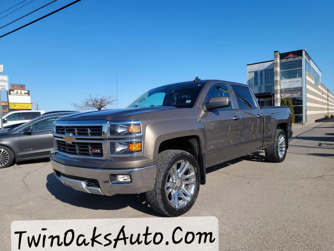 <p>Here’s your updated sales text without images:</p><hr /><h3><strong>2015 Chevrolet Silverado 1500 LT 2LT Z71 – Rugged Capability Meets Premium Comfort!</strong></h3><p>The <strong>2015 Chevy Silverado 1500 LT 2LT Z71</strong> is built for drivers who demand strength, style, and modern features. Equipped with a <strong>5.3L EcoTec3 V8</strong> delivering <strong>355 HP and 383 lb-ft of torque</strong>, this truck is ready to conquer highways, job sites, and off-road trails.</p><h4><strong>Z71 Off-Road Package Includes:</strong></h4><ul><li><strong>Rancho® shocks</strong> for superior off-road handling</li><li><strong>Hill Descent Control</strong> for controlled braking on steep declines</li><li><strong>Underbody skid plates</strong> for extra protection on rough terrain</li><li><strong>All-terrain tires</strong> for maximum grip in any condition</li><li><strong>Automatic locking rear differential</strong> for enhanced traction</li></ul><h4><strong>LT 2 Package (2LT) Upgrades:</strong></h4><ul><li><strong>Dual-zone automatic climate control</strong> for personalized comfort</li><li><strong>Heated front bucket seats</strong> for added luxury</li><li><strong>10-way power driver’s seat</strong> for a customizable ride</li><li><strong>Leather-wrapped steering wheel</strong> for a premium feel</li><li><strong>Remote start system</strong> for added convenience</li><li><strong>Rear vision camera</strong> for improved safety</li></ul><h4><strong>Towing & Performance Features:</strong></h4><ul><li><strong>4WD with Autotrac System</strong> for seamless switching between drive modes</li><li><strong>Up to 11,100 lbs towing capacity</strong> for serious hauling power</li><li><strong>EZ Lift & Lower tailgate</strong> for effortless access to the truck bed</li></ul><h4><strong>Modern Tech & Connectivity:</strong></h4><ul><li><strong>Chevrolet MyLink with an 8-inch touchscreen</strong> for easy infotainment control</li><li><strong>Bluetooth, USB ports, and a premium 6-speaker audio system</strong> for staying connected</li></ul><p>The <strong>2015 Silverado 1500 LT 2LT Z71</strong> offers the perfect combination of <strong>power, luxury, and rugged performance</strong>. Don’t miss out—this truck won’t last long!</p><p> <strong>Call now to schedule a test drive!</strong></p><p> </p><p><strong>Additional Certification Cost</strong>: The full certification cost for this vehicle is <strong>$890 + HST</strong>.</p><p><strong>What’s Included with Certification</strong>:</p><ul><li>The vehicle will be delivered with a <strong>valid safety certification</strong> and a <strong>36-day safety item warranty</strong> for your peace of mind.</li><li>A <strong>fresh oil change</strong> will be performed, and all fluids will be topped up.</li><li>The vehicle will be <strong>professionally detailed</strong>, ensuring it looks and feels like new when you pick it up.</li></ul><p>At <strong>Twin Oaks Auto</strong>, we are committed to providing a <strong>hassle-free car buying experience</strong>. From your first inquiry to driving off in your new car, our goal is to get you on the road quickly and stress-free!</p><p><strong>Financing Options Available!</strong><br />Flexible financing options are available to suit your needs. Contact us for more details.</p><p><strong>Contact Us Today</strong>:<br />📞 <strong>Call Us</strong>: 905-339-3330<br />📍 <strong>Location</strong>: 2470 Royal Windsor Drive, Oakville, Ontario, L6J 7Y2</p><p><br />(Conveniently located between Ford Drive and Winston Churchill Blvd.)</p><p><strong>More Information</strong>:<br />Visit our website at <strong><a href=http://www.twinoaksauto.com>TwinOaksAuto.com</a></strong> to view additional pictures, explore our inventory, and access CARFAX reports.</p><p> </p>