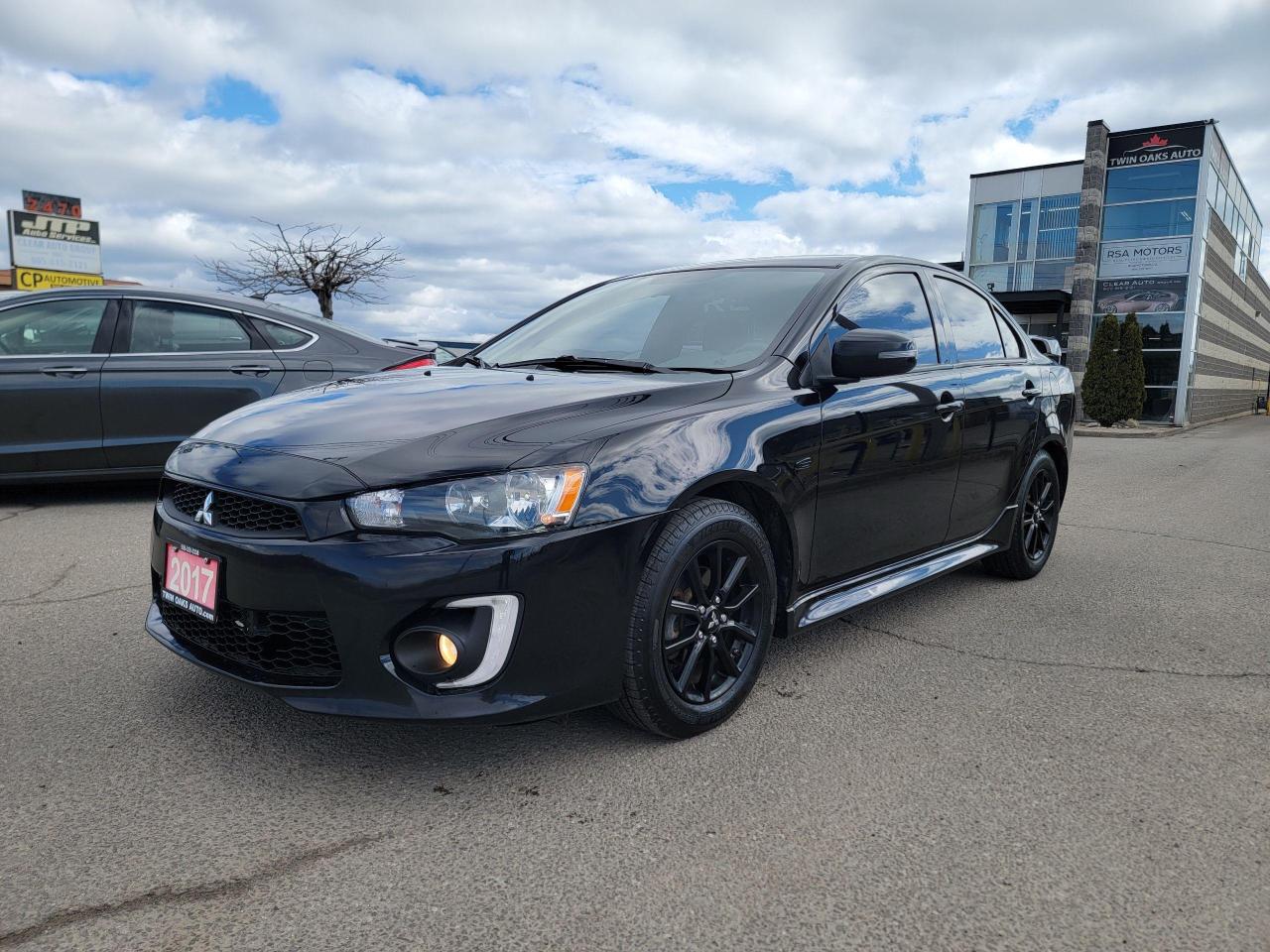 <p><strong>2017 Mitsubishi Lancer SE Black Edition – Local Ontario, One Owner, Clean Carfax, Excellent Condition!</strong></p><p>This <strong>2017 Mitsubishi Lancer SE Black Edition</strong> is a rare find, combining sporty aesthetics with reliable performance. A <strong>local Ontario vehicle with a clean Carfax</strong>, this Lancer has been well cared for and is in <strong>exceptional condition</strong> inside and out.</p><h3><strong>Standout Features:</strong></h3><ul><li><p><strong>Black Edition Package</strong> – Bold styling with blacked-out accents for a sleek, aggressive look</p></li><li><p><strong>Clean Carfax</strong> – No accidents, verified history for your peace of mind</p></li><li><p><strong>Local Ontario Car</strong> – Maintained to high standards with a strong service record</p></li><li><p><strong>Very Clean Condition</strong> – Well-kept interior and exterior with no major wear</p></li></ul><h3><strong>Performance & Efficiency:</strong></h3><ul><li><p><strong>2.0L 4-Cylinder Engine</strong> – Delivers a smooth, efficient, and responsive drive</p></li><li><p><strong>Automatic CVT Transmission</strong> – Seamless shifting for a comfortable ride</p></li><li><p><strong>Great Fuel Economy</strong> – Ideal for daily commuting and long drives</p></li><li><p><strong>Mitsubishi’s Legendary Reliability</strong> – Built to last with proven durability</p></li></ul><h3><strong>Interior & Comfort:</strong></h3><ul><li><p><strong>Heated Front Seats</strong> – Stay comfortable during the colder months</p></li><li><p><strong>Bluetooth Connectivity</strong> – Hands-free calling and music streaming</p></li><li><p><strong>Touchscreen Display & Backup Camera</strong> – Enhanced visibility and convenience</p></li><li><p><strong>Spacious Cabin & Cargo Room</strong> – Comfortable for passengers and practical for daily use</p></li></ul><h3><strong>Safety & Security:</strong></h3><ul><li><p><strong>Traction & Stability Control</strong> – Confident handling in all weather conditions</p></li><li><p><strong>Anti-Lock Braking System (ABS)</strong> – Enhanced stopping power for safety</p></li><li><p><strong>Multiple Airbags</strong> – Comprehensive protection for all occupants</p></li><li><p><strong>Reinforced Safety Frame</strong> – Designed for added durability and crash protection</p></li></ul><p>This <strong>2017 Mitsubishi Lancer SE Black Edition</strong> offers a perfect balance of sportiness, efficiency, and reliability. Whether you need a dependable daily driver or a stylish ride that stands out, this Lancer is ready to go.</p><p><strong>Call or text today to book a test drive!</strong> Don’t miss your chance to own this well-maintained, accident-free, Ontario-driven Lancer.</p><p><strong>Additional Certification Cost</strong>: The full certification cost for this vehicle is <strong>$790 + HST</strong>.</p><p><strong>What’s Included with Certification</strong>:</p><ul><li>The vehicle will be delivered with a <strong>valid safety certification</strong> and a <strong>36-day safety item warranty</strong> for your peace of mind.</li><li>A <strong>fresh oil change</strong> will be performed, and all fluids will be topped up.</li><li>The vehicle will be <strong>professionally detailed</strong>, ensuring it looks and feels like new when you pick it up.</li></ul><p>At <strong>Twin Oaks Auto</strong>, we are committed to providing a <strong>hassle-free car buying experience</strong>. From your first inquiry to driving off in your new car, our goal is to get you on the road quickly and stress-free!</p><p><strong>Financing Options Available!</strong><br />Flexible financing options are available to suit your needs. Contact us for more details.</p><p><strong>Contact Us Today</strong>:<br />📞 <strong>Call Us</strong>: 905-339-3330<br />📍 <strong>Location</strong>: 2470 Royal Windsor Drive, Oakville, Ontario, L6J 7Y2</p><p><br />(Conveniently located between Ford Drive and Winston Churchill Blvd.)</p><p><strong>More Information</strong>:<br />Visit our website at <strong><a href=http://www.twinoaksauto.com>TwinOaksAuto.com</a></strong> to view additional pictures, explore our inventory, and access CARFAX reports.</p><p> </p><p> </p>