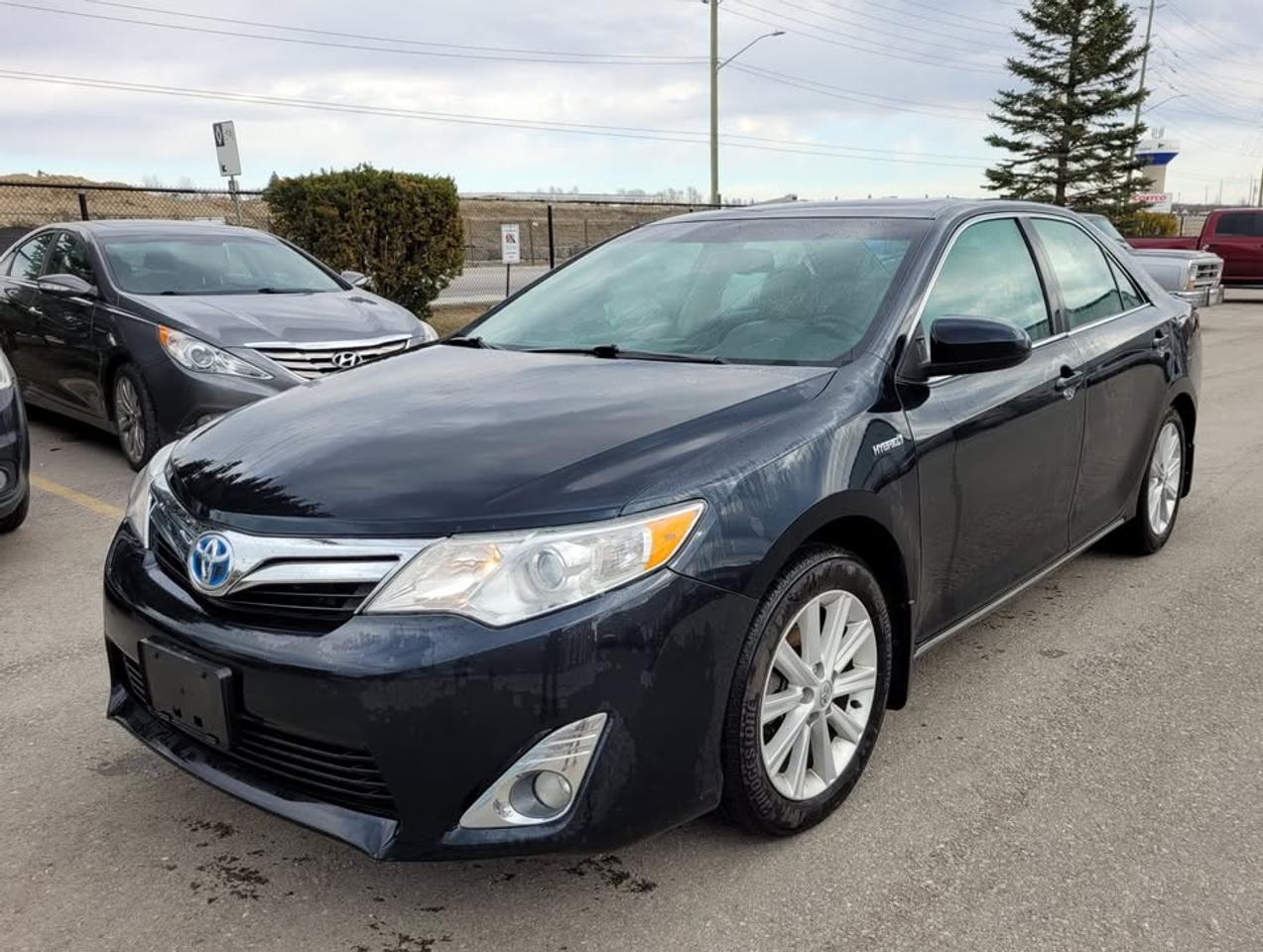 <p><span style=color: #080809; font-family: Segoe UI Historic, Segoe UI, Helvetica, Arial, sans-serif; font-size: 15px; white-space-collapse: preserve; background-color: #ffffff;>2013 Toyota Camry XLE Hybrid<br /><br /></span></p><p><span style=color: #080809; font-family: Segoe UI Historic, Segoe UI, Helvetica, Arial, sans-serif; font-size: 15px; white-space-collapse: preserve; background-color: #ffffff;>4cyl. Auto Hybrid w/189,451km<br /><br /></span></p><p><span style=color: #080809; font-family: Segoe UI Historic, Segoe UI, Helvetica, Arial, sans-serif; font-size: 15px; white-space-collapse: preserve; background-color: #ffffff;>Keyless start, Sunroof, Navigation, etc.<br /><br /></span></p><p><span style=color: #080809; font-family: Segoe UI Historic, Segoe UI, Helvetica, Arial, sans-serif; font-size: 15px; white-space-collapse: preserve; background-color: #ffffff;>Includes summer & winter tires on rims<br /><br /></span></p><p><span style=color: #080809; font-family: Segoe UI Historic, Segoe UI, Helvetica, Arial, sans-serif; font-size: 15px; white-space-collapse: preserve; background-color: #ffffff;>In good condition overall.<br /><br /></span></p><p><span style=color: #080809; font-family: Segoe UI Historic, Segoe UI, Helvetica, Arial, sans-serif; font-size: 15px; white-space-collapse: preserve; background-color: #ffffff;>Runs and drives great!<br /><br /></span></p><p>&nbsp;</p><p><span style=color: #080809; font-family: Segoe UI Historic, Segoe UI, Helvetica, Arial, sans-serif; font-size: 15px; white-space-collapse: preserve; background-color: #ffffff;>Asking $11,900, certified and ready to go!<br /><br /><br /></span></p><p><span style=color: #080809; font-family: Segoe UI Historic, Segoe UI, Helvetica, Arial, sans-serif; font-size: 15px; white-space-collapse: preserve; background-color: #ffffff;>Our price includes all taxes, fees, licensing, etc. to transfer the vehicle into your name (comparable to other listings at $10,000 x HST + certification + licensing, etc.). <br /><br /></span></p><p><span style=color: #080809; font-family: Segoe UI Historic, Segoe UI, Helvetica, Arial, sans-serif; font-size: 15px; white-space-collapse: preserve; background-color: #ffffff;>**Please note that we are a business, open from Mon-Fri 9AM-5PM. We will only be available to meet during those times. Thank you!**<br /><br /><br /></span></p><p>&nbsp;</p>