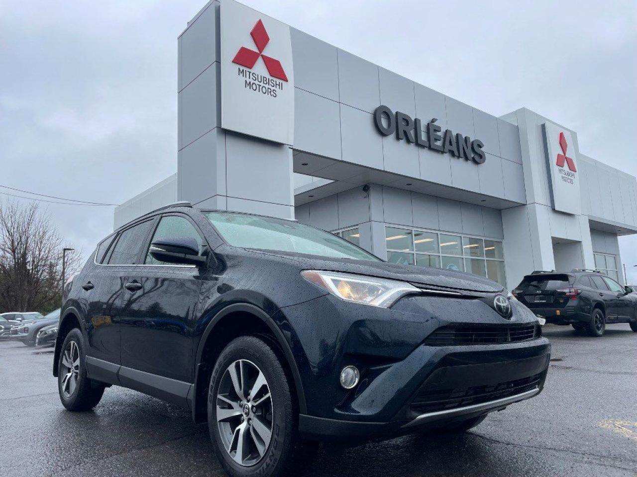 This 2018 Toyota RAV4 XLE is a well-maintained SUV with all the features you need for comfort, safety, and convenience  plus two full sets of tires (summer and winter) for year-round peace of mind. Heated seats & heated steering wheel Power sunroof & power liftgate Adaptive cruise control & lane departure warning Rearview camera All-weather mats Includes both winter and all-season tires Toyotas reputation for reliability paired with practical features makes this RAV4 a smart, ready-to-drive choice. **ADVERTISED SALE PRICE IS BASED ON FINANCE PURCHASE**
