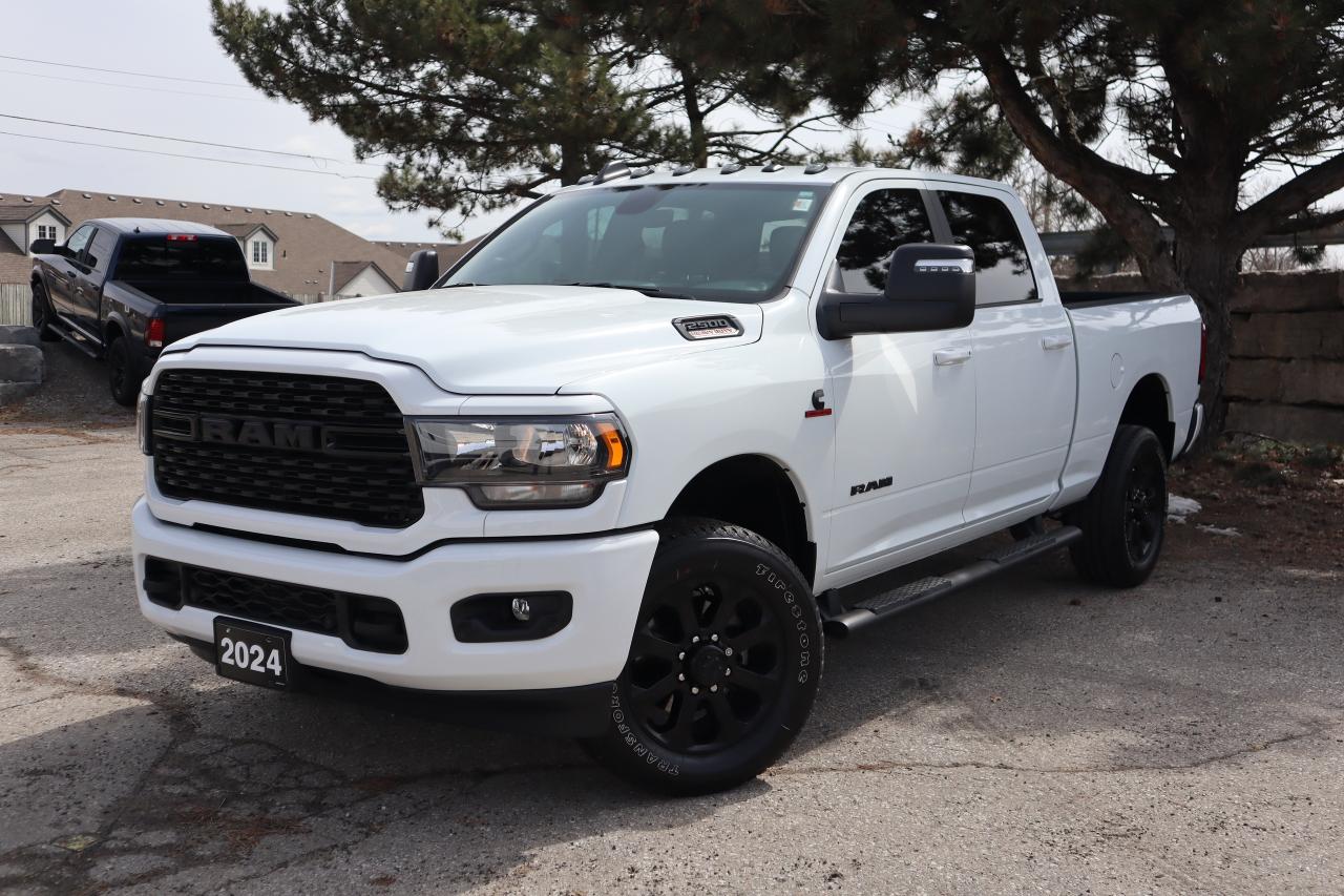 NAVIGATION, BACK UP CAMERA, HEATED SEATS AND WHEEL, BLIND SPOT DETECTION, REMOTE START, APPLE CAR PLAY, TOUCH SCREEN, ALPINE STEREO, AND MORE!!!

Our One Owner, Accident-Free 2024 RAM 2500 Big Horn Crew Cab 4X4 in Bright White is engineered to make quick work out of your challenging tasks! A heavy-duty suspension is standard for a confident ride, and our Four Wheel Drive truck has no-nonsense good looks with eye-catching details. This mighty machine is ready to rule the road with black wheels, body-color accents, heated power trailer mirrors, bright bumpers, running boards, a spray-on bedliner, and a Class V receiver hitch.

Big-time advantages in our Big Horn cabin include comfortable heated cloth front seats, a tiltable heated steering wheel, air conditioning, power accessories, door-sill scuff plates, pushbutton ignition, a 12V power outlet, keyless access, cruise control, and clever storage solutions. A Uconnect infotainment system with a 3.5-inch driver display, a 5-inch touchscreen, navigation, voice control, Bluetooth®, and a six-speaker Alpine sound system is also at your service.

RAM supplies a rearview camera, hill start assistance, trailer sway control, ABS, tire pressure monitoring, stability/traction control, advanced airbags, and more for safer days. That makes our 2500 Big Horn a great way to grow your business! Save this Page and Call for Availability. We Know You Will Enjoy Your Test Drive Towards Ownership! 

Bustard Chrysler prides ourselves on our expansive used car inventory. We have over 100 pre-owned units in stock of all makes and models, with the largest selection of pre-owned Chrysler, Dodge, Jeep, and RAM products in the tri-cities. Our used inventory is hand-selected and we only sell the best vehicles, for a fair price. We use a market-based pricing system so that you can be confident youre getting the best deal. With over 25 years of financing experience, our team is committed to getting you approved - whether you have good credit, bad credit, or no credit! We strive to be 100% transparent, and we stand behind the products we sell. For your peace of mind, we offer a 3 day/250 km exchange as well as a 30-day limited warranty on all certified used vehicles.