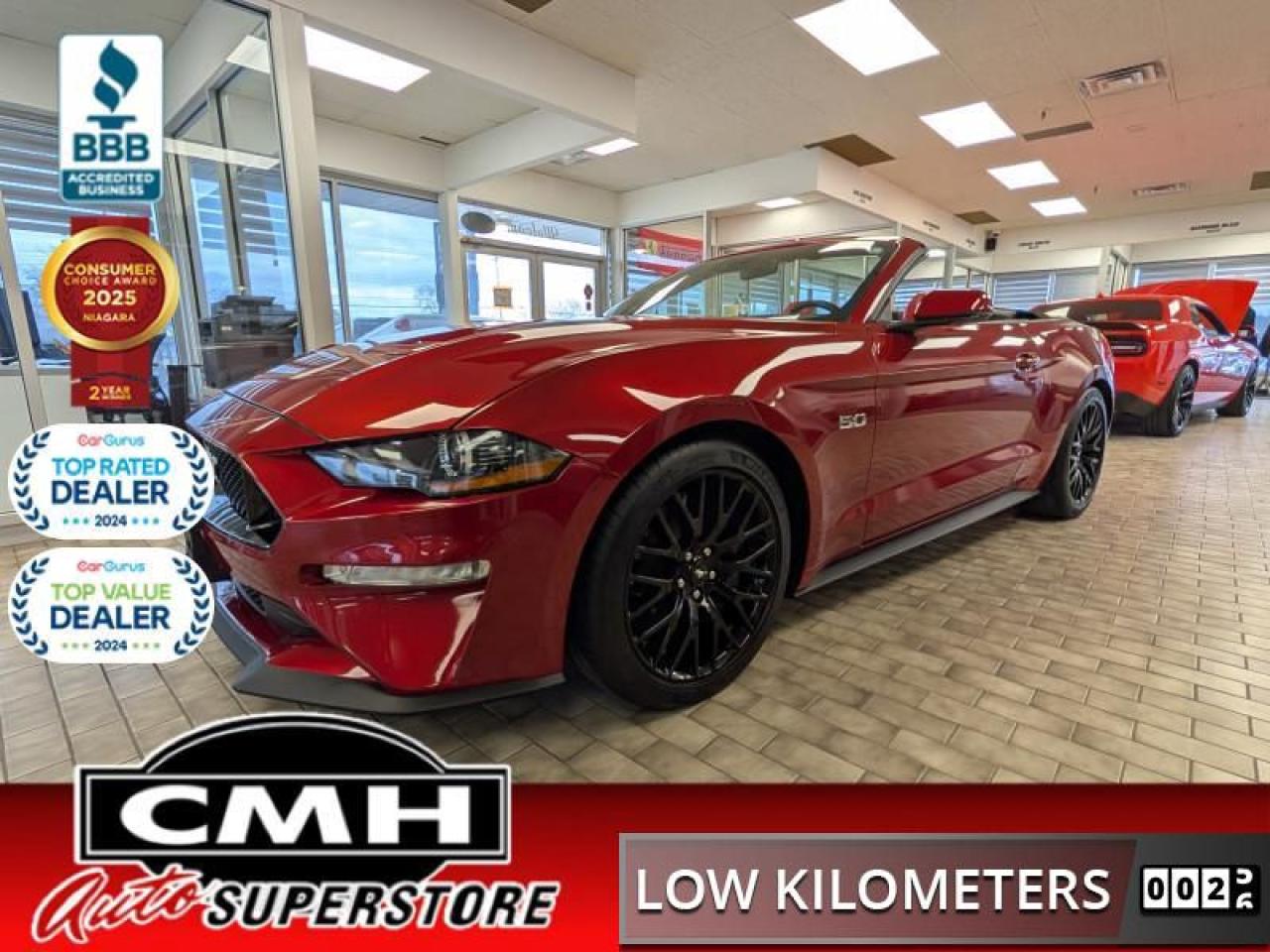 <b>ONLY 24,000 KMS !! 5.0L V8 CONVERTIBLE !! GT PERFORMANCE PACKAGE, FORD SAFE & SMART PACKAGE, MAGNERIDE DAMPING SYSTEM, ACTIVE VALVE PERFORMANCE EXHAUST, EQUIPMENT GROUP 401A, RAPID RED METALLIC. ALMOST $15,000 IN FACTORY UPGRADES !! <br> <br></b><br>  <br>CMH certifies that all vehicles meet DOUBLE the Ministry standards for Brakes and Tires<br><br> <br>    This  2020 Ford Mustang is for sale today. <br> <br>This Ford Mustang takes styling cues from the past, while looking deep into the future with a perfect blend of retro and modern styling. A performance car through and through, this Mustang offers responsive driving dynamics, a comfortable ride and smiles by the mile. Its easy to see why the Ford Mustang is still a true American icon. This low mileage  convertible has just 23,495 kms. Its  red in colour  . It has an automatic transmission and is powered by a  460HP 5.0L 8 Cylinder Engine. <br> <br> Our Mustangs trim level is GT Premium Fastback. Crank up the power with this Mustang GT Premium offering an exceptional list of features such as leather seats with cooling and heating capability, unique aluminum wheels, SYNC 3 infotainment system with navigation, Apple CarPlay and Android Auto on a larger 8 inch touchscreen with enhanced voice recognition. Additional features include front fog lights, a front lip spoiler, proximity key for push button start and keyless entry, a leather steering wheel and gear shifter, streaming audio, a rearview camera with rear parking sensors, power front seats, a limited slip differential and 50-50 split folding bench seat to make loading large items a breeze. This vehicle has been upgraded with the following features: Navigation,  Leather Seats,  Cooled Seats,  Park Assist,  Aluminum Wheels,  Power Seat,  Sync. <br> To view the original window sticker for this vehicle view this <a href=http://www.windowsticker.forddirect.com/windowsticker.pdf?vin=1FATP8FF9L5148891 target=_blank>http://www.windowsticker.forddirect.com/windowsticker.pdf?vin=1FATP8FF9L5148891</a>. <br/><br> <br>To apply right now for financing use this link : <a href=https://www.cmhniagara.com/financing/ target=_blank>https://www.cmhniagara.com/financing/</a><br><br> <br/><br>Trade-ins are welcome! Financing available OAC ! Price INCLUDES a valid safety certificate! Price INCLUDES a 60-day limited warranty on all vehicles except classic or vintage cars. CMH is a Full Disclosure dealer with no hidden fees. We are a family-owned and operated business for over 30 years! o~o