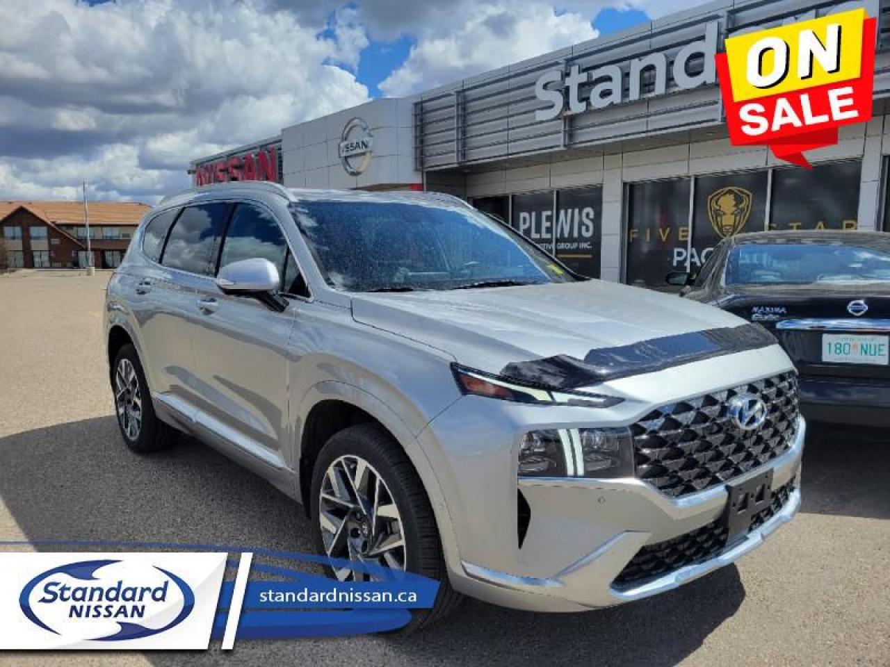 <b>5 STAR PKG<br><br> <br></b><br>   Compare at $37299 - Our Price is just $36110! <br> <br>   For adventure, readiness, and outstanding style, this 2022 Santa Fe is an easy choice. This  2022 Hyundai Santa Fe is fresh on our lot in Swift Current. <br> <br>Refinement wrapped in ruggedness, capability married to style, and adventure ready attitude paired to a comfortable drive. These things make this 2022 Santa Fe an amazing SUV. If you need a ready to go SUV that makes every errand an adventure and makes every adventure a journey, this 2022 Santa Fe was made for you.This  SUV has 65,761 kms. Its  shimmering silver in colour  . It has an automatic transmission and is powered by a  281HP 2.5L 4 Cylinder Engine. <br> <br> Our Santa Fes trim level is Ultimate Calligraphy AWD. Sporting an upgraded drivetrain for a more exciting driving experience, this luxurious and high tech Santa Fe Ultimate Calligraphy is a great choice for people that prefer the finer things in life. With a sunroof above your heated and cooled Nappa leather seats, every drive becomes a day spa. A heads up display, navigation, and 12 speaker premium audio system by Harman Kardon create a futuristic and helpful cockpit. A proximity power liftgate for hands free operation, a 360 degree aerial parking camera, and remote automatic parking make your busy days easier. This fun and family friendly SUV also comes with Android Auto, Apple CarPlay, and Bluetooth to keep you entertained. Helping you stay safe is an advanced driver assist suite including lane keep assist, collision avoidance assist, and distance pacing cruise. Additional features include a heated steering wheel, aluminum wheels, automatic LED lighting, and remote keyless entry.<br> <br>To apply right now for financing use this link : <a href=https://www.standardnissan.ca/finance/apply-for-financing/ target=_blank>https://www.standardnissan.ca/finance/apply-for-financing/</a><br><br> <br/><br>Why buy from Standard Nissan in Swift Current, SK? Our dealership is owned & operated by a local family that has been serving the automotive needs of local clients for over 110 years! We rely on a reputation of fair deals with good service and top products. With your support, we are able to give back to the community. <br><br>Every retail vehicle new or used purchased from us receives our 5-star package:<br><ul><li>*Platinum Tire & Rim Road Hazzard Coverage</li><li>**Platinum Security Theft Prevention & Insurance</li><li>***Key Fob & Remote Replacement</li><li>****$20 Oil Change Discount For As Long As You Own Your Car</li><li>*****Nitrogen Filled Tires</li></ul><br>Buyers from all over have also discovered our customer service and deals as we deliver all over the prairies & beyond!#BetterTogether o~o