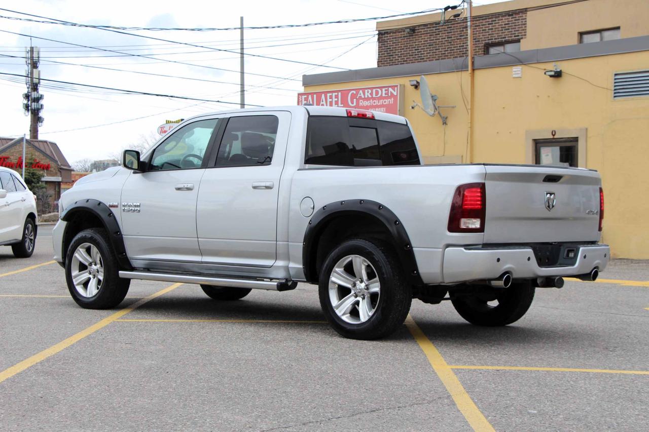 2013 RAM 1500 4WD Crew Cab 140.5" Sport - Photo #5