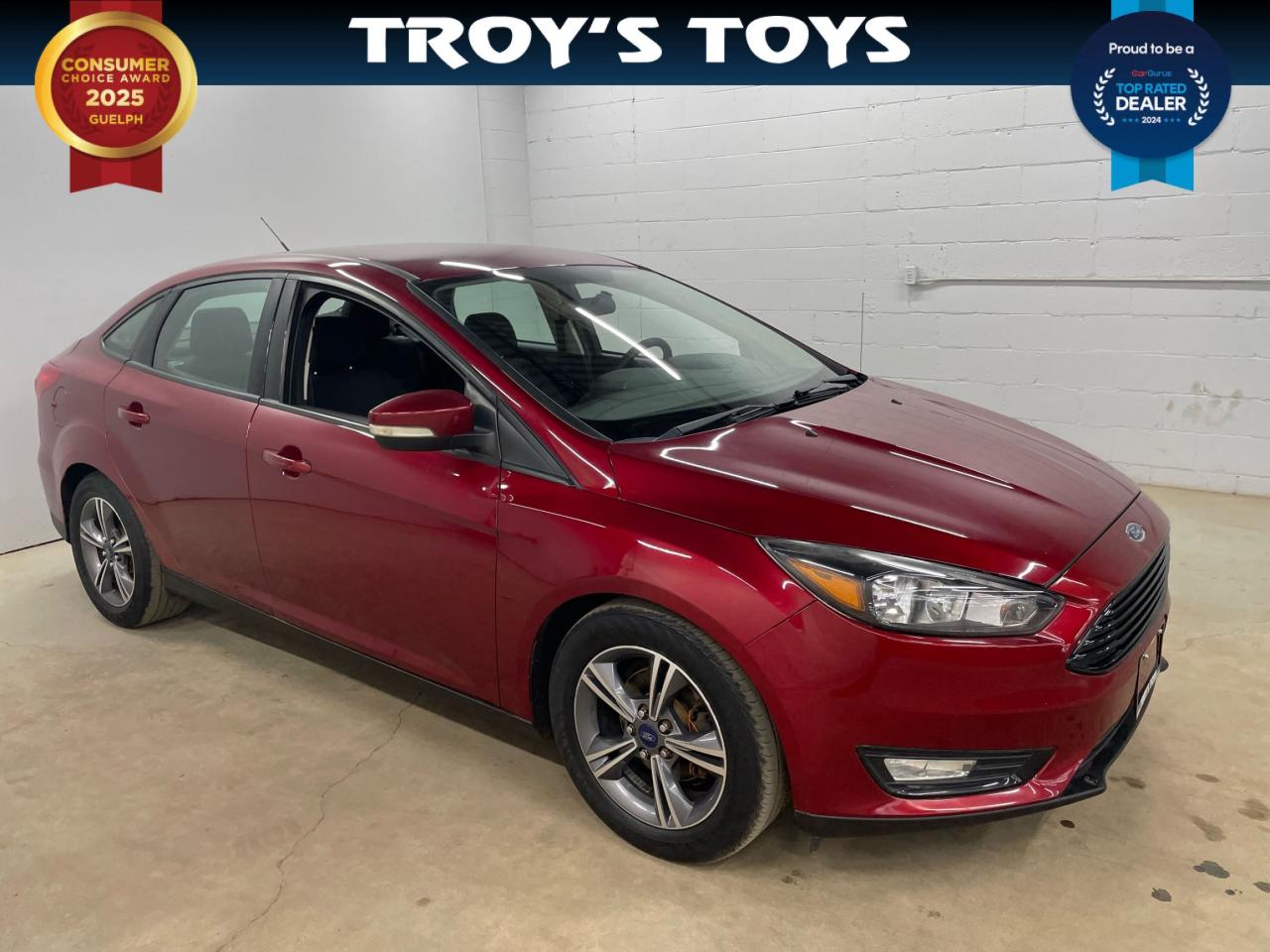 <p>Looking for a reliable and stylish compact sedan? Look no further than this 2016 Ford Focus SE, available now at Troys Toys! This striking red beauty boasts a sleek exterior and a comfortable black interior. Under the hood, youll find a fuel-efficient 1L I3 engine paired with a smooth-shifting automatic transmission, making for a fun and economical drive. With its front-wheel drive system, this Focus handles beautifully on Canadian roads, no matter the weather. This Focus is ready to take on your daily commute and weekend adventures, offering you the perfect blend of practicality and performance.</p><p>At Troys Toys, we pride ourselves on offering quality pre-owned vehicles at competitive prices. This 2016 Ford Focus SE has been meticulously inspected and comes with a clean title and a low mileage of 133,792 km. Dont miss out on this fantastic opportunity to own a reliable and stylish sedan. Stop by Troys Toys today for a test drive and see for yourself why this Focus is a steal!</p><p>Here are 5 of the most sizzling features of this 2016 Ford Focus SE:</p><ol><li><strong>Sleek Red Exterior:</strong> Turn heads wherever you go with this eye-catching red paint job.</li><li><strong>Comfortable Black Interior:</strong> Enjoy a spacious and stylish interior with premium black cloth upholstery.</li><li><strong>Fuel-Efficient 1L I3 Engine:</strong> Save money at the pump with this powerful yet economical engine.</li><li><strong>Smooth Automatic Transmission:</strong> Enjoy effortless gear changes for a comfortable and relaxing ride.</li><li><strong>Low Mileage:</strong> With only 133,792 km on the odometer, this Focus is just getting started.</li></ol><p><strong><em>Powered by AutoIntelligence™</em></strong> Vehicle information has been generated using artificial intelligence and is provided for informational purposes only. While efforts are made to ensure accuracy, please confirm all details directly with the dealer.</p>