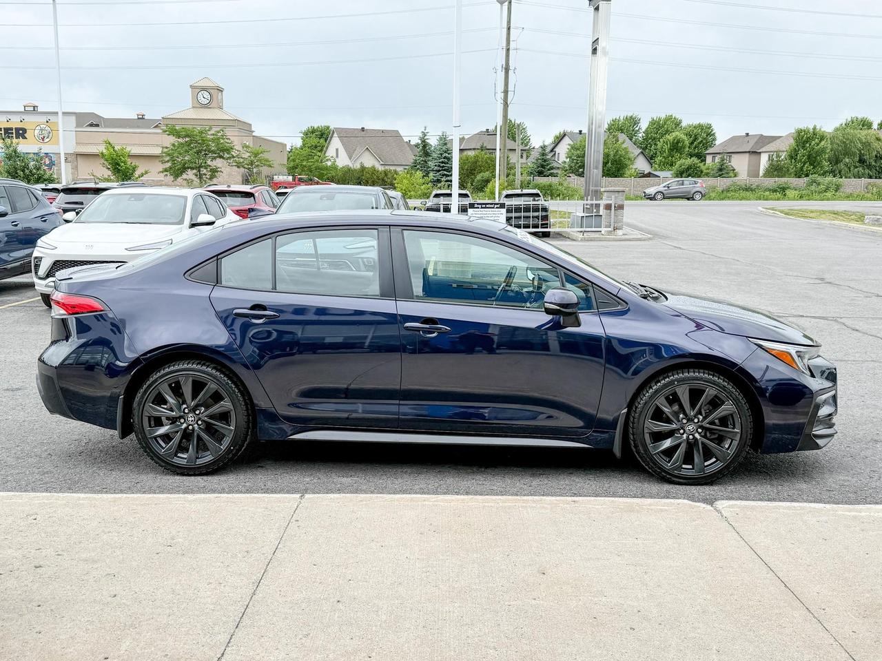 2023 Toyota Corolla 2.0L 4CYL, SE UPGRADE PACKAGE - 18" BLACK ALLOY RIMS, SUNROOF, HEATED LEATHER WRAPPED STEERING WHEEL Photo