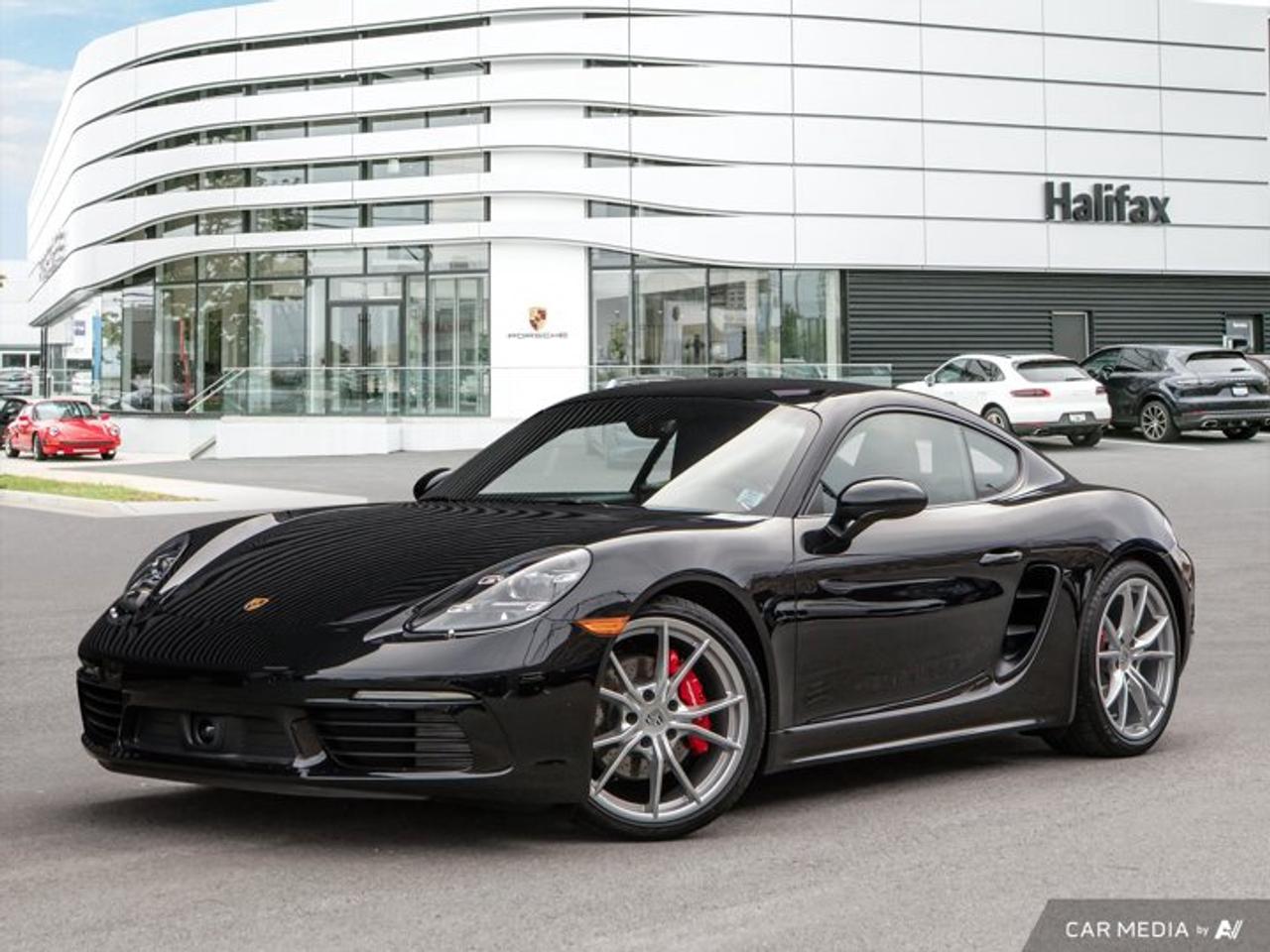 *Now Available at Porsche of Halifax: 2025 Porsche 718 Cayman S.*Refined in *Jet Black Metallic* with a beautifully customized *Black leather interior featuring Bordeaux Red deviated stitching*, the *2025 Porsche 718 Cayman S* delivers razor-sharp handling and timeless coupe design. Perfectly balanced and intuitively responsive, this mid-engine sports car is built for pure driving pleasure---with a bespoke touch.*Performance and Dynamics*  *   Equipped with *Porsche Active Suspension Management (PASM)*, lowered 10mm for sharpened handling and road feedback.  *   *Power Steering Plus*, *20 Carrera S Wheels*, and *PDK dual-clutch transmission* ensure dynamic responsiveness and everyday comfort.  *   *Adaptive Cruise Control* and *Lane Change Assist* add confidence and composure in all driving conditions.*Interior Comfort and Craftsmanship*  *   The *Premium Package* includes *14-way Power Sport Seats*, *ventilated seats*, *heated multifunction GT Sport Steering Wheel*, and *Porsche Entry & Drive* for everyday luxury.  *   Custom *Bordeaux Red deviated stitching* details extend across the *seats*, *dashboard*, *door panels*, *center console*, and *steering wheel rim*, creating a truly unique interior aesthetic.  *   Additional refinements include *Electric Steering Column*, *BOSE® Surround Sound System*, and the *Porsche Crest on Headrests*.*Technology and Design Details*  *   Outfitted with *LED Headlights with PDLS*, *Light Design Package*, and *Power Folding Exterior Mirrors with Courtesy Lighting*.  *   Includes *Exclusive Design Fuel Cap*, *Luggage Net*, and *Dashcam Preparation* for modern practicality and sophistication.Striking a perfect balance between tailored luxury and motorsport-bred performance, the 2025 Cayman S is more than a sports car---its a Porsche made to move you.*Contact Porsche of Halifax today* to book your private viewing.