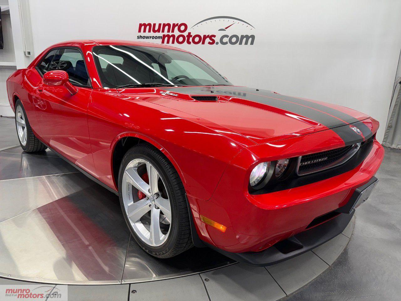 <p><span style=color:black>Vehicle Highlights include: SRT8 Package, 6.1L Hemi, 5 Speed Auto with Autostick, Power Sunroof, 20 Inch Alcoa Alloy 5 Spoke Wheels, Red Brembo Brake Calipers, Carbon Fiber Hood Decal Stripes, Dual Exhaust, Satin Black SRT Rear Spoiler, Chrome Metal Fuel Door, 13 speakers Kicker SRT High Performance Audio System, Bluetooth, Remote Start, Navigation, CD Player, SRT Sport Bucket Seats, Heated Front Seats, 6 Way Driver Seat, Leather Seats with Alcantara Interior Trim, White Faced Gauges, & WeatherTech Front Floor Liners, </span></p><p><span style=color:black>In the golden age of American muscle, few names carry the same weight as the Dodge Challenger. When Dodge resurrected this icon, it did more than evoke nostalgiait reignited a horsepower war. The 2010 Dodge Challenger SRT8 stands as a testament to modern muscle car engineering wrapped in retro-inspired design.</span></p><p><span style=color:black>The 2010 Challenger SRT8 captures the essence of its 1970s predecessor with bold lines, a wide stance, and a menacing front grille. Classic styling cueslike the long hood, short rear deck, and retro badgingmerge seamlessly with 21st-century performance.</span></p><p><span style=color:black>At the core of the SRT8 lies a naturally aspirated 6.1-liter HEMI V8 engine, churning out 425 horsepower and 420 lb-ft of torque. Paired with either a 5-speed automatic transmission with Autostick, the SRT8 offers blistering straight-line speed and a visceral exhaust note that echoes pure American muscle. 0 to 60 mph comes in around 4.9 secondsrespectable even by todays standards.</span></p><p><span style=color:black>Painted in the iconic Torred colour. Is it orange? Is it red? The answer is both,the illusive color gives off orange hues in bright lighting and a reddish tone in darker lighting.</span></p><p><span style=color:black>Inside, the black leather and Alcantara sport seats offer both luxury and grip. The cabin is driver-focused, with aluminum pedals, a leather-wrapped SRT steering wheel, and retro-inspired gauges.</span></p><p><span style=color:black>Equipment includes 20-inch alloy wheels, HID headlights, heated seats, and keyless entry/start. Safety is well covered with features like stability control, anti-lock brakes, and multiple airbags.</span></p><p><span style=color:black>The 2010 Dodge Challenger SRT8 is a celebration of muscle car heritage with the bones and brains of modern engineering. Whether youre a longtime Mopar fan or a newcomer to American performance cars, the SRT8 offers an authentic, thrilling experience that's hard to match.</span></p><p><span style=color:black>1 owner with a clean Carfax. Come on down to Munro Motors & see this one for yourself, its in stock. We will look forward to seeing you real soon!</span></p><p></p><p>Carfax: <a href=https://vhr.carfax.ca/en/?id=w7EzJvW%2FcNCl7jZv4qSyvLQn3KqgYwZM rel=nofollow>https://vhr.carfax.ca/en/?id=w7EzJvW%2FcNCl7jZv4qSyvLQn3KqgYwZM</a></p><p><span style=color:rgb( 51 , 51 , 51 )>Yes we take trade in vehicles.</span></p><p><span style=color:rgb( 51 , 51 , 51 )>Check us out on youtube: </span><a href=https://www.youtube.com/user/MunroMotors1 rel=nofollow>click here</a></p><p><span style=color:rgb( 51 , 51 , 51 )>Like us on Facebook: </span><a href=https://www.facebook.com/munromotors/ rel=nofollow>https://www.facebook.com/munromotors/</a></p><p><span style=color:rgb( 51 , 51 , 51 )>We are located in Brantford, Ontario; Telephone City and the hometown of hockey legend Wayne Gretzky. Formerly located in St. George, Ontario for ten years, we are still east of London, south of Cambridge, and west of Hamilton.</span></p><p><span style=color:rgb( 51 , 51 , 51 )>In order to get our customers to come here, we have to have great prices and then when you get here, we have to have a great car in order to earn your business.</span></p><p><span style=color:rgb( 51 , 51 , 51 )>Our business hours are Monday to Friday 10am to 5pm. We are closed on Saturdays and Sundays.</span></p><p><span style=color:rgb( 51 , 51 , 51 )>At Munro Motors, we find unique vehicles and post our entire stock online in order to ensure that our vehicles find their happy home.</span></p><p><span style=color:rgb( 51 , 51 , 51 )>To ensure our customers can get what they've always wanted, we offer financing services through TD Auto Finance, Desjardins, CIBC Auto Finance and Independent Leasing Companies on vehicles that are less than ten model years old and boats that are less than twenty-five model years old.</span></p><p><span style=color:rgb( 51 , 51 , 51 )>We also offer warranty products through Lubrico and GVC warranties to ensure that your mechanical baby stays in tip-top condition.</span></p><p><span style=color:rgb( 51 , 51 , 51 )>All of our vehicles are hand-picked by the very knowledgeable owner, Andy Munro, who has been connecting people to their dreams for many years.</span></p><p><a href=http://Munromotors.com rel=nofollow><span style=color:rgb( 51 , 51 , 51 )>Munromotors.com</span></a></p><p><span style=color:rgb( 51 , 51 , 51 )>Email: <u>sales@munromotors.com</u></span></p><p><span style=color:rgb( 51 , 51 , 51 )>Most of our vehicles are already reconditioned, saftied, etested and ready to drive home with you.</span></p><p><span style=color:rgb( 51 , 51 , 51 )>Delivery is available. Ask for details</span></p><p><span style=color:rgb( 51 , 51 , 51 )>All prices are subject to HST and licensing, no hidden fees.</span></p><p><span style=color:rgb( 51 , 51 , 51 )>Financing is available for good credit and bruised credit. OAC as low as 7.99% for well qualified applicants. Ask us for details.</span></p><p></p>