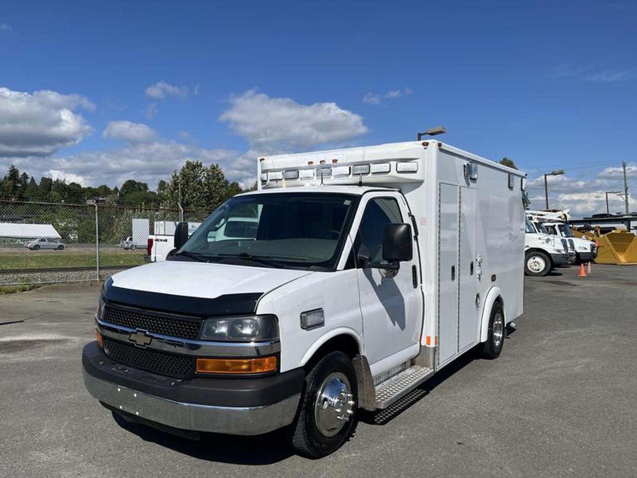 2016 Chevrolet Express G3500 cube van (ex-ambulance) powered by a 6.0L V8 OHV 16V FFV gasoline engine with automatic transmission and rear-wheel drive. Built on the heavy-duty G3500 chassis, this unit offers a reinforced cube body commonly repurposed for service, utility, or specialty conversion applications.
With 8,163 engine hours, this vehicle includes cruise control, air conditioning, AM/FM radio, power door locks, power windows, and power mirrors. Finished in white with a grey cloth interior, the enclosed rear box provides a square, functional workspace suitable for mobile operations, custom builds, or commercial use where durability and interior volume are required. Inside rear measurements are 68 inches high, from rear wall to back door are 134 inches, 84 inches wide.  $12,910.00 plus $375 processing fee, $13,285.00 total payment obligation before taxes.   Listing report, warranty, contract commitment cancellation fee, financing available on approved credit (some limitations and exceptions may apply). All above specifications and information is considered to be accurate but is not guaranteed and no opinion or advice is given as to whether this item should be purchased. We do not allow test drives due to theft, fraud, acts of vandalism and undetectable impaired driving. Instead we provide the following benefits: Complimentary Warranty (with options to extend), Limited Money Back Satisfaction Guarantee on Fully Completed Contracts, Contract Commitment Cancellation, and an Open-Ended Sell-Back Option. Ask seller for details or call 604-522-REPO(7376) to confirm listing availability.