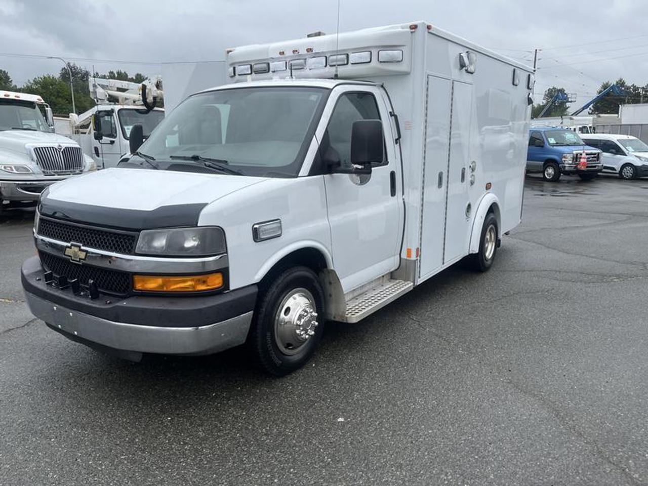 2016 Chevrolet Express G3500 cube van (ex-ambulance) powered by a 6.0L V8 engine with automatic transmission and rear-wheel drive. Built on the heavy-duty G3500 chassis, this unit offers a durable platform commonly repurposed for service, utility, or specialty conversion use.
The rear box provides a square, enclosed workspace with ambulance-grade construction. With 8,989 engine hours, this vehicle is well suited for commercial use, mobile operations, or custom up fitting projects where a reinforced body and high payload capacity are required. Inside rear measurements are 68 inches high, from rear wall to back door are 134 inches, 84 inches wide.  $13,720.00 plus $375 processing fee, $14,095.00 total payment obligation before taxes.   Listing report, warranty, contract commitment cancellation fee, financing available on approved credit (some limitations and exceptions may apply). All above specifications and information is considered to be accurate but is not guaranteed and no opinion or advice is given as to whether this item should be purchased. We do not allow test drives due to theft, fraud, acts of vandalism and undetectable impaired driving. Instead we provide the following benefits: Complimentary Warranty (with options to extend), Limited Money Back Satisfaction Guarantee on Fully Completed Contracts, Contract Commitment Cancellation, and an Open-Ended Sell-Back Option. Ask seller for details or call 604-522-REPO(7376) to confirm listing availability.