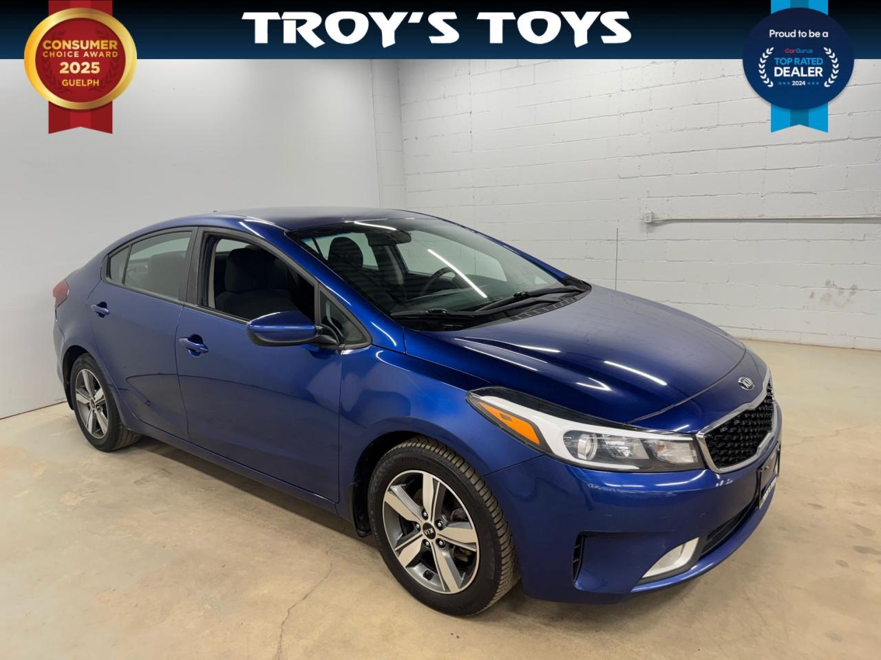 <p>Looking for a reliable and stylish sedan? Check out this 2018 Kia Forte LX, available now at Troys Toys! This eye-catching blue sedan with a sleek black interior offers a comfortable and practical driving experience. With its automatic transmission and front-wheel drive, the Forte LX is perfect for navigating city streets and beyond. This well-maintained vehicle has 131,264km on the odometer.</p><p>This 2018 Kia Forte LX is packed with features designed to make every drive enjoyable. Its fuel-efficient gasoline engine ensures youll spend less time at the pump and more time on the road. The four-door configuration provides easy access for passengers and cargo alike, making it a versatile choice for individuals and families. The Forte LX delivers a great blend of practicality and modern design.</p><p>Here are five standout features that make this 2018 Kia Forte LX a great choice:</p><ul><li><strong>Sleek and Stylish Design:</strong> Turn heads wherever you go with its modern blue exterior.</li><li><strong>Comfortable Interior:</strong> Enjoy a relaxing ride with the black interior.</li><li><strong>Fuel Efficiency:</strong> Save money on gas with its efficient gasoline engine.</li><li><strong>Automatic Transmission:</strong> Experience smooth and effortless driving with the automatic transmission.</li><li><strong>Practical Sedan:</strong> Benefit from the convenience of four doors for passengers and cargo.</li></ul><p><strong><em>Powered by AutoIntelligence™</em></strong> Vehicle information has been generated using artificial intelligence and is provided for informational purposes only. While efforts are made to ensure accuracy, please confirm all details directly with the dealer.</p>