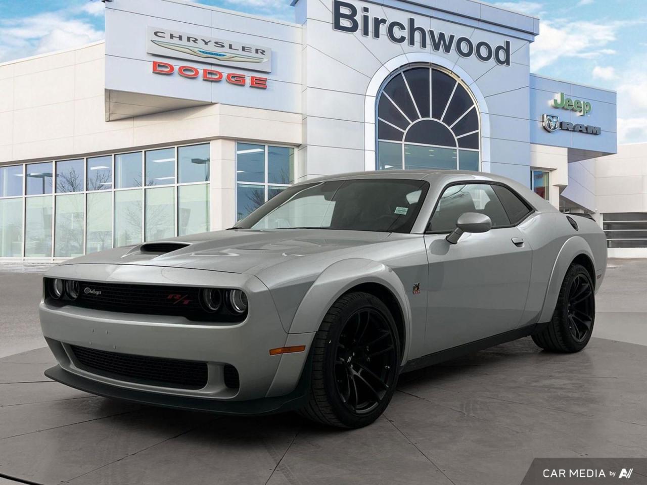 Accident Free!
Experience raw power and classic muscle car charm with this lightly used 2023 Dodge Challenger Scat Pack 392 Widebody. With only 5,561 km on the odometer and a clean accident history, this Triple Nickel beauty is ready to dominate the streets.

Key Features:
- Potent 6.4L engine with rear-wheel drive
- Widebody fender flares for an aggressive stance
- Brembo fixed front caliper 6-piston brakes for superior stopping power
- Adaptive damping suspension for optimal handling
- 20x11-inch Carbon Black aluminum wheels
- Uconnect 4C NAV with 8.4-inch display
- harman/kardon Sound Group for premium audio experience
- Leather flat-bottom steering wheel for enhanced control

Dont miss your chance to own this thrilling piece of American muscle. Visit Birchwood Chrysler Dodge Jeep Ram today to schedule a test drive and experience the raw power of the Challenger Scat Pack 392 Widebody for yourself. Our knowledgeable staff is ready to answer any questions and guide you through the purchasing process. Reserve your ride now and prepare for an adrenaline-pumping driving experience!
With us, Experience is Everything. Complete as much or as little of your purchase online as you like. All pricing is what you see is what you pay. No hidden fees. On our website you can choose payment options and terms knowing these are transparent and accurate.

Start your purchase online to build your exact pricing to your specifics like how much money down, vehicle trade and any accessories or added optional protection that suits your needs.

Any questions let us know by calling (204) 774-4444, wed love to send you a video to clarify any questions about a vehicle!

Visit us in store at 90-3965 Portage Ave in the Pointe West Autopark.

Dealer permit #5686
Dealer permit #5686