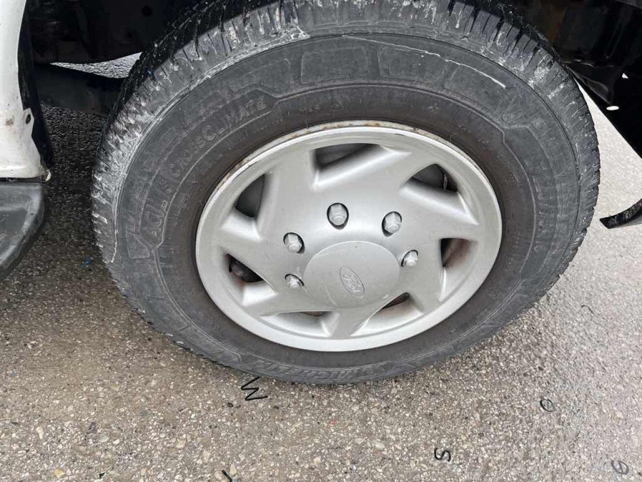 12565946