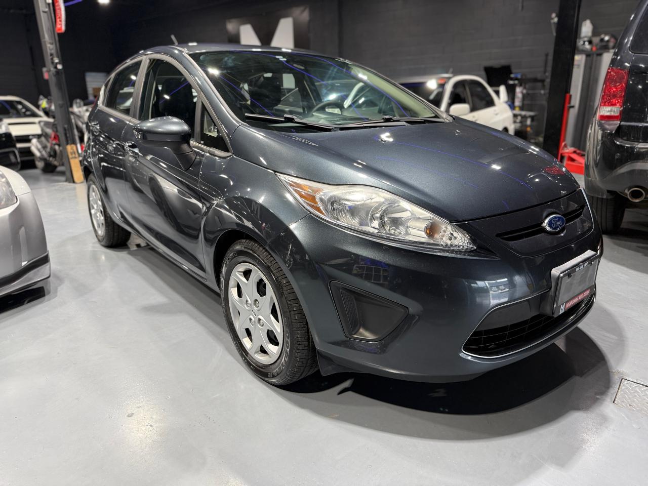 <p data-start=113 data-end=252>🚗 <strong data-start=116 data-end=179>2011 Ford Fiesta SE FOR SALE – Reliable, Affordable & Accident-Free!</strong> 🚗<br data-start=182 data-end=185 />📍 <em data-start=188 data-end=252>Mississauga Auto Group | 2666 Royal Windsor Dr, Unit #11 & #12</em></p><p data-start=254 data-end=294><strong data-start=254 data-end=294>💥 Sale Price: Only $5,950 + Tax! 💥</strong></p><p data-start=296 data-end=422>Looking for a reliable and fuel-efficient car? Check out this <strong data-start=358 data-end=381>2011 Ford Fiesta SE</strong> — a perfect daily commuter or first car!</p><h3 data-start=424 data-end=444>🔧 Key Features:</h3><ul data-start=445 data-end=683><li data-start=445 data-end=500><p data-start=447 data-end=500>✅ <strong data-start=449 data-end=463>199,000 km</strong> – Smooth-running and well-maintained</p></li><li data-start=501 data-end=542><p data-start=503 data-end=542>✅ <strong data-start=505 data-end=520>Clean Title</strong> – No liens, no issues</p></li><li data-start=543 data-end=588><p data-start=545 data-end=588>✅ <strong data-start=547 data-end=564>Accident-Free</strong> – Full CARFAX available</p></li><li data-start=589 data-end=634><p data-start=591 data-end=634>✅ <strong data-start=593 data-end=608>Fully Stock</strong> – Original and unmodified</p></li><li data-start=635 data-end=683><p data-start=637 data-end=683>✅ <strong data-start=639 data-end=663>Regularly Maintained</strong> – Drives excellent!</p></li></ul><h3 data-start=685 data-end=707>🛡️ Peace of Mind:</h3><ul data-start=708 data-end=811><li data-start=708 data-end=747><p data-start=710 data-end=747>🧾 <strong data-start=713 data-end=747>Aftermarket Warranty Available</strong></p></li><li data-start=748 data-end=811><p data-start=750 data-end=811>💰 <strong data-start=753 data-end=783>Flexible Financing Options</strong> – All credit types welcome!</p></li></ul><h3 data-start=813 data-end=837>📞 Contact Us Today:</h3><p data-start=838 data-end=956><strong data-start=838 data-end=864>Mississauga Auto Group</strong><br data-start=864 data-end=867 />📍 2666 Royal Windsor Dr, Unit #11 & #12, Mississauga, ON L5J 4N1<br data-start=932 data-end=935 />📞 <strong data-start=938 data-end=956>(905) 808-1198</strong></p><p> </p><p data-start=958 data-end=1046>💬 <strong data-start=961 data-end=1006>Message now or call to book a test drive!</strong><br data-start=1006 data-end=1009 />🚘 Drive away in your next car today!</p><p> </p><p>CARFAX REPORT : <a class=in-cell-link style=font-family: Arial; font-size: 10pt; text-align: center; href=https://vhr.carfax.ca/?id=LXGHipyJqM+FWwhB3cX8CofFDyHbefEh target=_blank rel=noopener>https://vhr.carfax.ca/?id=LXGHipyJqM+FWwhB3cX8CofFDyHbefEh</a></p>