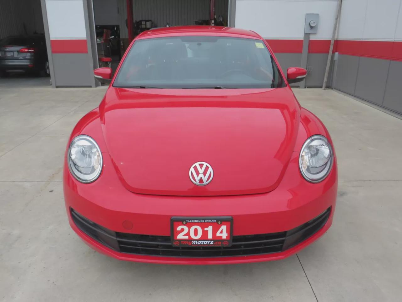 2014 Volkswagen Beetle Coupe TDI Comfortline (**LOW LOW KMS ON THIS SWEET BUG!!!**CLEAN CARFAX**DIESEL**ALLOY RIMS**AUTOMATIC** POWER WINDOWS**POWER LOCKS**BLUETOOTH**AM/FM/CD PLAYER**HEATED SEATS**) Photo