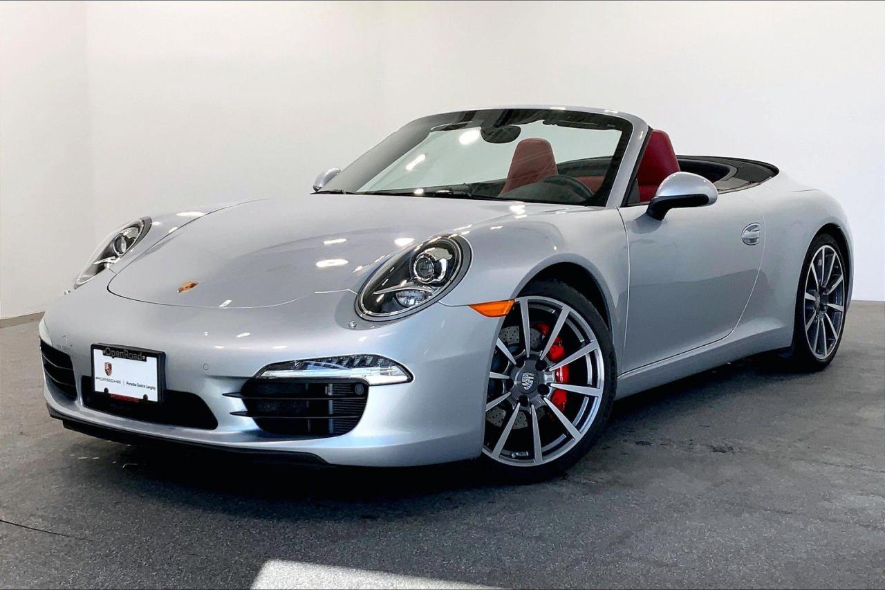 This Vehicle is Highly Equipped with the Premium Package Plus with Power Sport Seats, BOSE Audio Package, Sport Chrono Package, 7-Speed Porsche Doppelkupplung (PDK), SportDesign Steering Wheel, Auto Start Stop, and much more! This 2015 Porsche 911 Carrera S Cabriolet (991) with PDK comes in Rhodium Silver Metallic with a Two-Tone Black/Garnet Red Leather Interior and a Black Convertible Top! This is a Local BC Vehicle! This vehicle is a Porsche Approved Certified Pre-Owned Vehicle: 2 extra years of unlimited mileage warranty plus an additional 2 years of Porsche Roadside Assistance. All CPO vehicles have passed our rigorous 111-point check and reconditioned with 100% genuine Porsche parts. We Accept All Trade-Ins and Buy-Ins!! For more details or to schedule a test drive with one of our highly trained sales executives please call or send a website enquiry now before it is gone. 604-530-8911. Porsche Center Langley has won the prestigious Porsche Premier Dealer Award eight years in a row. We are centrally located just a short distance from Highway 1 in beautiful Langley, British Columbia. Our hope is to have you driving your dream vehicle soon. Please note that additional fees, including a $599 documentation fee & a $690 dealer prep fee, apply to all pre-owned vehicles. Dealer #40136