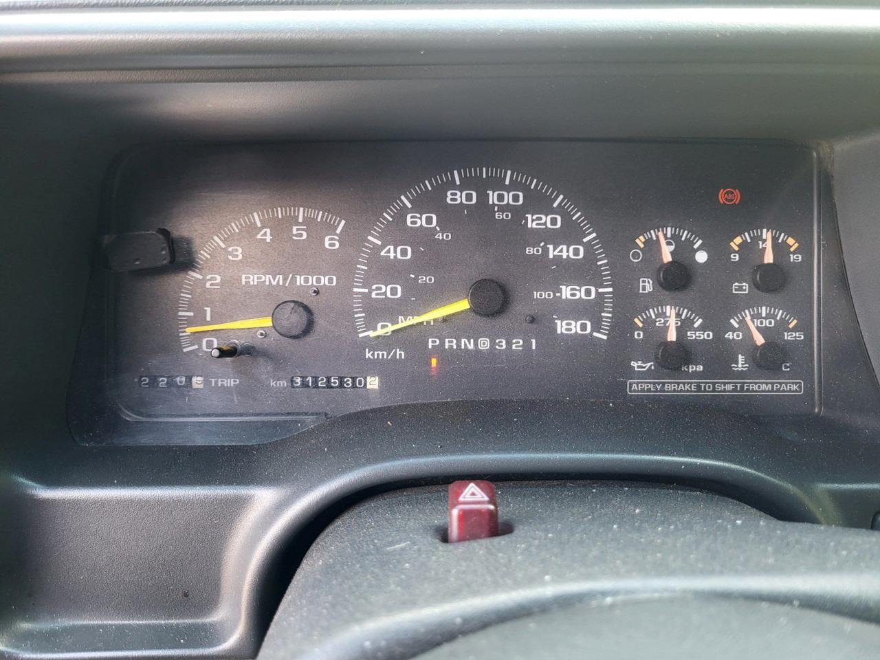 12577112