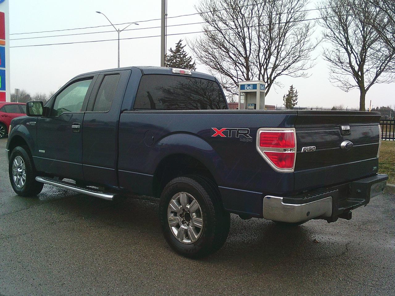 2013 Ford F-150 4WD SuperCab XLT Lariat Photo