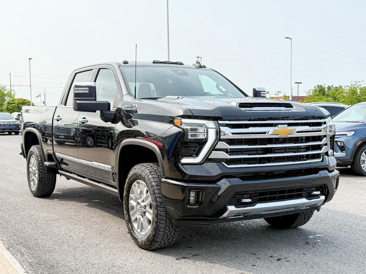 2025 Chevrolet Silverado 2500 HD High Country 6.6L DURAMAX WITH REMOTE START/ENTRY, SUNROOF, HEATED SEATS, HEATED STEERING WHEEL, VENTILATED SEATS, BOSE SOUND SYSTEM, POWER UP/DOWN TAILGATE Photo