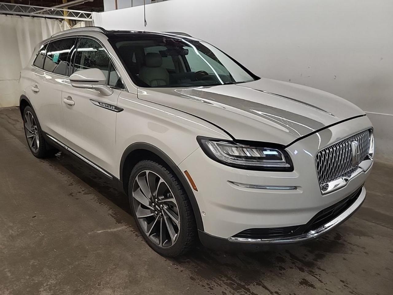 THE PRICE YOU SEE, PLUS GST. GUARANTEED!    APPLE CARPLAY/ANDROID AUTO COMPATABLE! 2.7 LITER GTDI V6, 8 SPEED AUTO, RESERVE TRIM(201a), ACTIVE PARK ASSIST, CARGO UTILITY PKG, 22 WAY POWER DRIVER SEAT, CLASS II TOW PKG, ADAPTIVE CRUISE WITH LANE CENTERING.     The 2021 Lincoln Nautilus Reserve with the 2.7-liter twin-turbocharged EcoBoost V6 engine and the 201A Equipment Group package embodies a sophisticated blend of luxury, performance, and advanced technology, catering to drivers seeking a premium midsize SUV experience. The 2.7-liter V6 produces around 335 horsepower and 380 lb-ft of torque, delivering strong acceleration and confident highway performance while maintaining reasonable fuel efficiency. The Reserve trim enhances the vehicles upscale appeal with premium interior materials, including leather upholstery, wood accents, and meticulous craftsmanship, creating a refined and comfortable cabin environment. The 201A package adds a suite of advanced features such as a large SYNC 3 infotainment system with a touchscreen display, Apple CarPlay and Android Auto compatibility, a premium audio system, and sophisticated driver-assistance technologies like Lincoln Co-Pilot 360, which includes features such as adaptive cruise control, lane-keeping assist, and automatic emergency braking. The exterior design exudes elegance with sleek lines, a distinctive grille, and LED lighting elements, while the interior emphasizes comfort with heated and ventilated front seats, a panoramic sunroof, and customizable ambient lighting. Overall, the 2021 Lincoln Nautilus Reserve with the 2.7-liter engine and 201A package offers a luxurious, well-equipped SUV that balances power, style, and advanced safety features for a refined driving experience.Do you want to know more about this vehicle, CALL, CLICK OR COME ON IN!*AMVIC Licensed Dealer; CarFax and Full Mechanical Inspection Included.