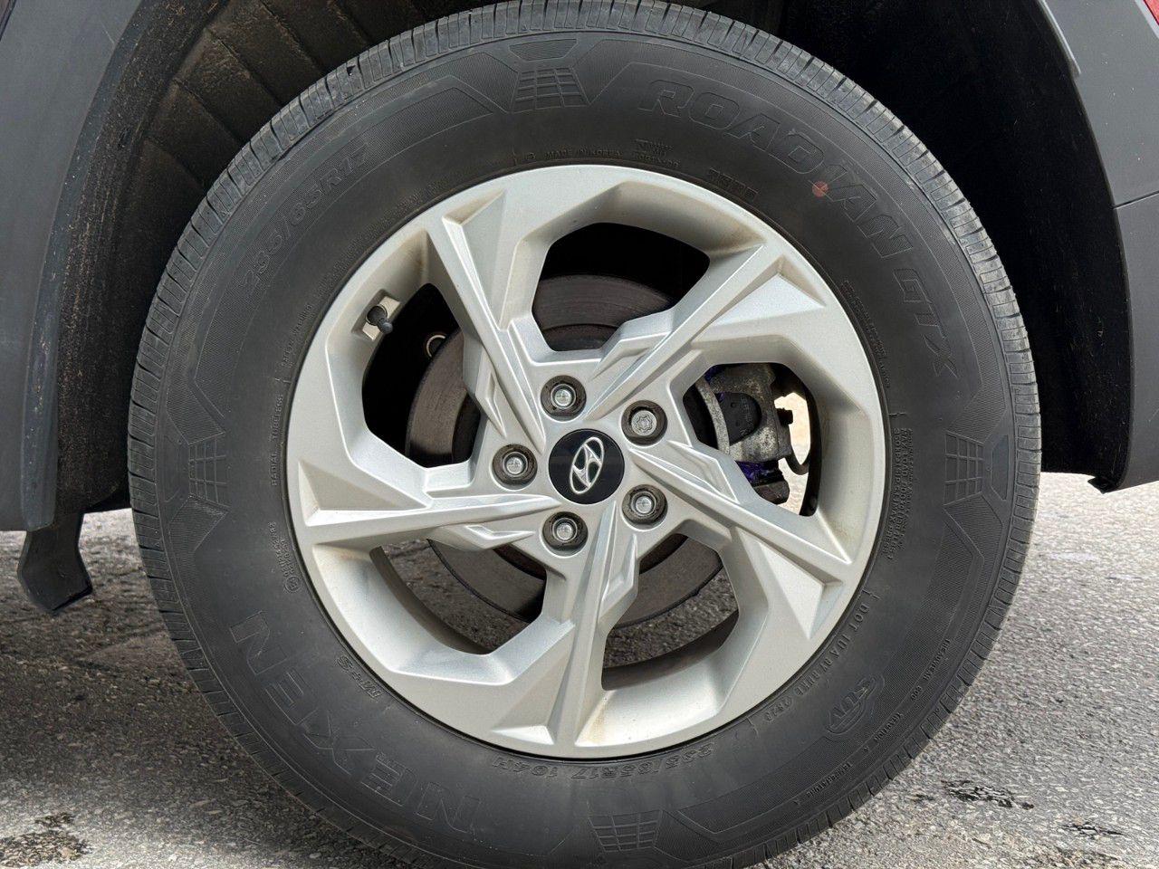 12597433