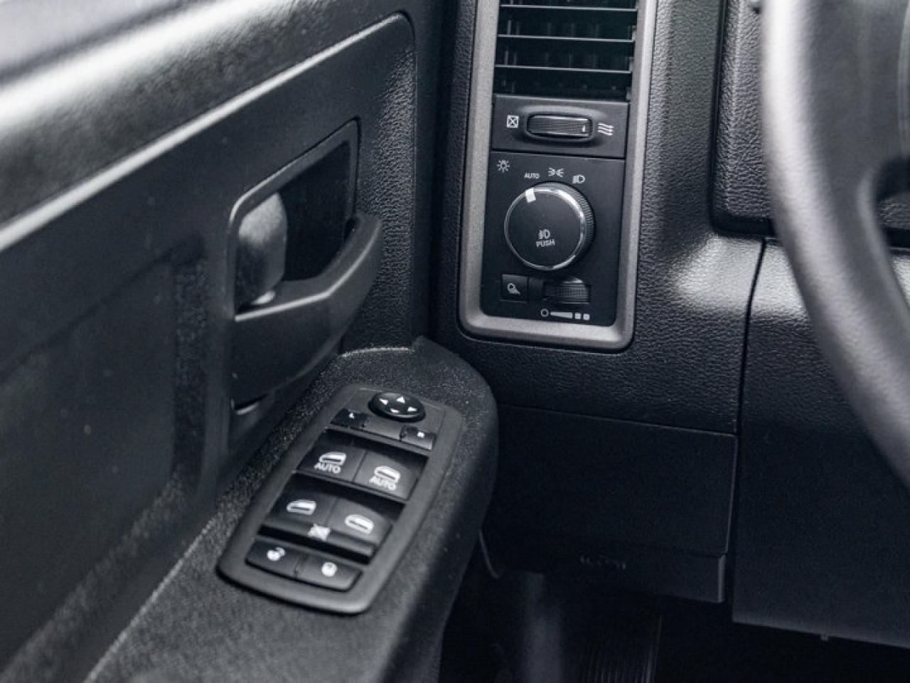 12597700