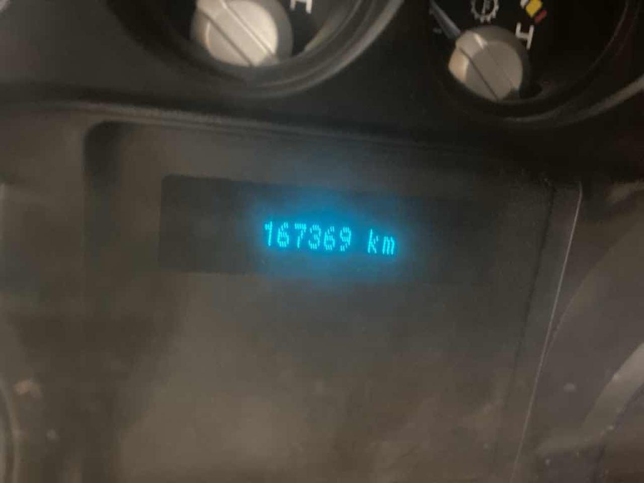 12599077