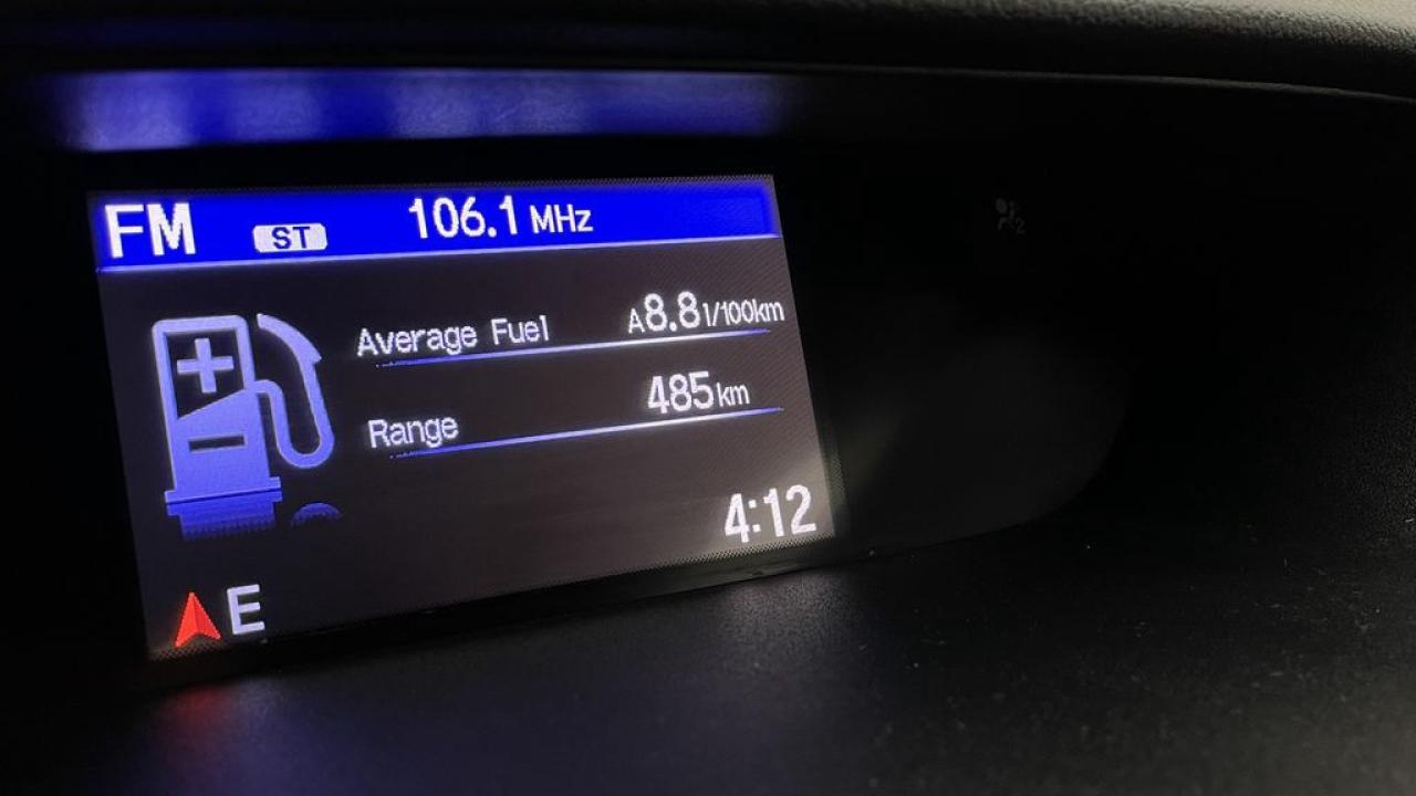 12613735