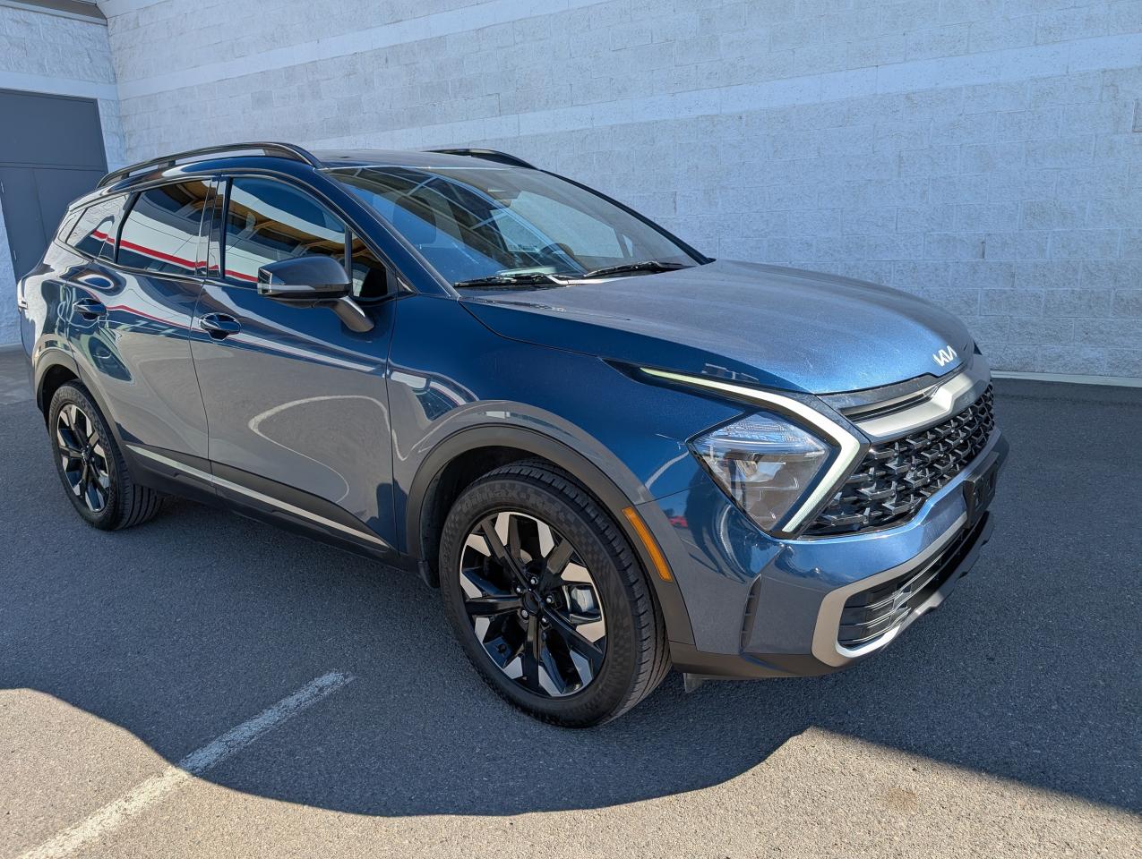 <p>Looking for a stylish and capable SUV thats ready for anything? Check out this used 2023 Kia Sportage X-Line, now available at Smithers Toyota! This eye-catching blue SUV is a perfect blend of practicality and modern design, ready to elevate your daily drives and weekend adventures. With only 67,900 KM on the odometer, this Sportage is just getting started, offering you years of reliable performance and comfort. Its all-wheel-drive system ensures confident handling in various weather conditions, making it an ideal choice for Canadian roads.</p><p> </p><p>Inside, youll find a well-appointed cabin designed with your comfort in mind. The X-Line trim offers a range of features to enhance your driving experience, from heated front seats to a heated leather steering wheel. Advanced safety technologies like Blind-spot Collision-Avoidance Assist and Rear Cross-Traffic Collision Avoidance Assist provide added peace of mind on every journey. This Sportage is more than just a vehicle; its a statement of style and a commitment to a comfortable and secure driving experience.</p><p> </p><p>Here are five standout features that make this Kia Sportage X-Line a must-see:</p><p><br /><br /></p><ul><ul><li><strong>Heated Leather Steering Wheel:</strong> Enjoy ultimate comfort on chilly mornings.</li></ul></ul><p> </p><ul><ul><li><strong>All-Wheel Drive:</strong> Conquer any road condition with confidence.</li></ul></ul><p> </p><ul><ul><li><strong>Blind-spot Collision-Avoidance Assist:</strong> Stay safe with advanced safety technology.</li></ul></ul><p> </p><ul><ul><li><strong>Heated Front Bucket Seats:</strong> Experience luxurious comfort on every drive.</li></ul></ul><p> </p><ul><ul><li><strong>Rear View Monitor with Parking Guidance Back-Up Camera:</strong> Make parking a breeze.</li></ul></ul><p><br /><br /></p><p><strong><em>Powered by AutoIntelligence™</em></strong><br />Vehicle information has been generated using artificial intelligence and is provided for informational purposes only. While efforts are made to ensure accuracy, please confirm all details directly with the dealer.</p><p> </p>