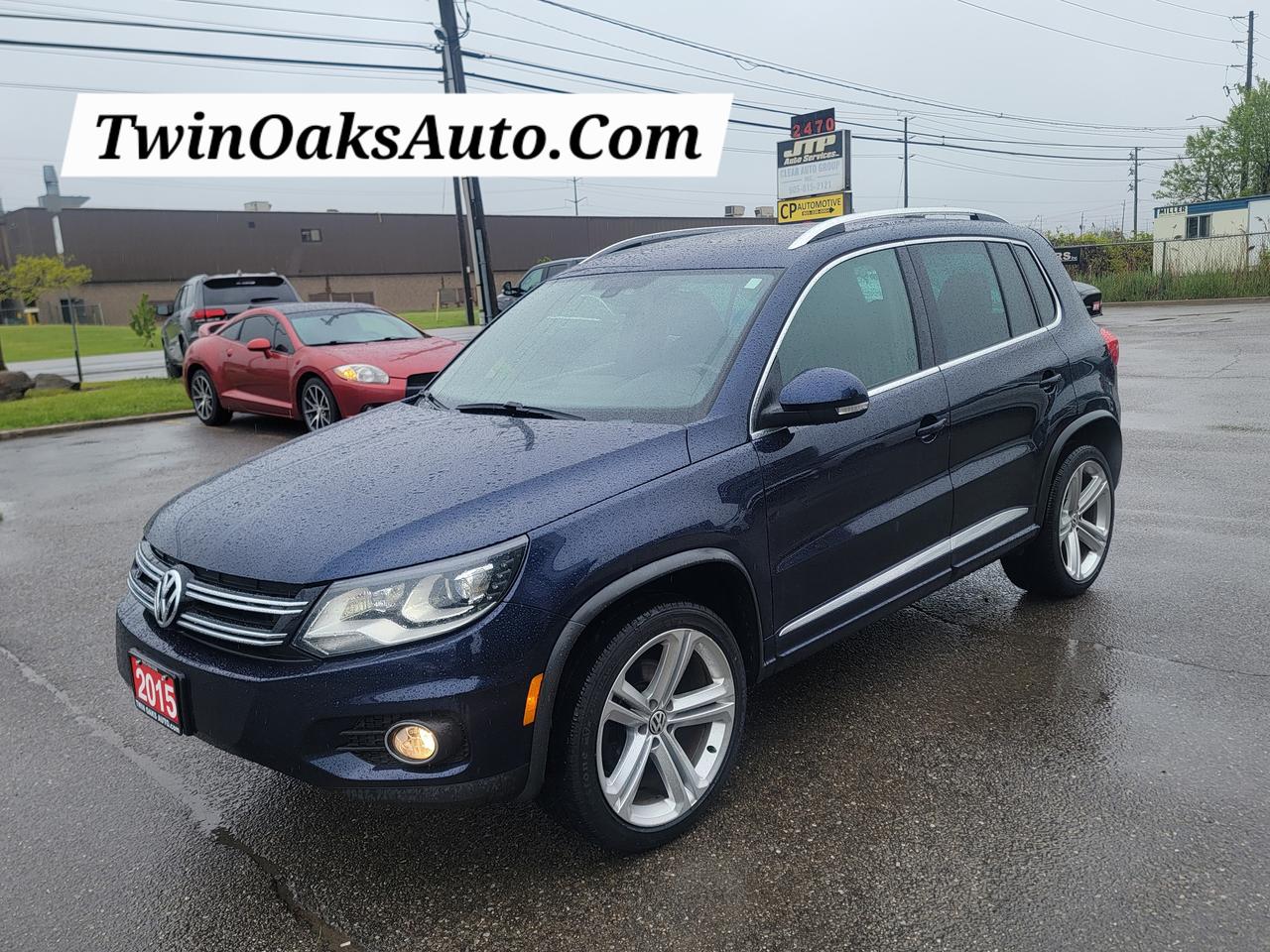 <p>For sale: 2015 Volkswagen Tiguan Highline with R-Line Package &mdash; a top-trim compact SUV that blends luxury, performance, and sharp styling in one refined package.</p><p>Equipped with a 2.0L turbocharged engine, 6-speed automatic transmission, and 4MOTION all-wheel drive, this Tiguan Highline offers a smooth and confident ride. The R-Line package adds aggressive exterior accents, unique bumpers, and sportier design cues.</p><p>Fully loaded with premium features, including:</p><ul><li><p>2.0L Turbocharged I4 Engine</p></li><li><p>6-Speed Automatic Transmission</p></li><li><p>4MOTION All-Wheel Drive</p></li><li><p>R-Line Styling Package (unique bumpers, side skirts, R-Line badging)</p></li><li><p>19-Inch Alloy Wheels</p></li><li><p>Bi-Xenon Headlights with LED Daytime Running Lights</p></li><li><p>Panoramic Power Sunroof</p></li><li><p>Leather Upholstery</p></li><li><p>Power Adjustable Front Seats with Memory Function</p></li><li><p>Heated Front Seats</p></li><li><p>Dual-Zone Automatic Climate Control</p></li><li><p>Fender Premium Audio System</p></li><li><p>Touchscreen Infotainment System with Navigation</p></li><li><p>Bluetooth Connectivity</p></li><li><p>SiriusXM Satellite Radio</p></li><li><p>Rearview Camera</p></li><li><p>Front and Rear Parking Sensors</p></li><li><p>Keyless Access with Push-Button Start</p></li><li><p>Auto-Dimming Rearview Mirror</p></li><li><p>Rain-Sensing Wipers</p></li><li><p>Power Folding Heated Side Mirrors</p></li><li><p>Split-Folding Rear Seats</p></li><li><p>Ambient Interior Lighting</p></li><li><p>Cruise Control</p></li><li><p>Advanced Safety Features including ABS, Stability Control, and Multiple Airbags</p></li></ul><p>&nbsp;</p><p>This Tiguan Highline with R-Line styling delivers top-tier comfort, advanced tech, and all-weather capability &mdash; all in a sleek, sporty package. Ideal for those seeking refinement and performance. Ready for your test drive.</p><p><strong>Additional Certification Cost</strong>: The full certification cost for this vehicle is <strong>$790 + HST</strong>.</p><p><strong>What&rsquo;s Included with Certification</strong>:</p><ul><li>The vehicle will be delivered with a <strong>valid safety certification</strong> and a <strong>36-day safety item warranty</strong> for your peace of mind.</li><li>A <strong>fresh oil change</strong> will be performed, and all fluids will be topped up.</li><li>The vehicle will be <strong>professionally detailed</strong>, ensuring it looks and feels like new when you pick it up.</li></ul><p>At <strong>Twin Oaks Auto</strong>, we are committed to providing a <strong>hassle-free car buying experience</strong>. From your first inquiry to driving off in your new car, our goal is to get you on the road quickly and stress-free!</p><p><strong>Financing Options Available!</strong><br />Flexible financing options are available to suit your needs. Contact us for more details.</p><p><strong>Contact Us Today</strong>:<br />📞 <strong>Call Us</strong>: 905-339-3330<br />📍 <strong>Location</strong>: 2470 Royal Windsor Drive, Oakville, Ontario, L6J 7Y2</p><p><br />(Conveniently located between Ford Drive and Winston Churchill Blvd.)</p><p><strong>More Information</strong>:<br />Visit our website at <strong><a href=http://www.twinoaksauto.com>TwinOaksAuto.com</a></strong> to view additional pictures, explore our inventory, and access CARFAX reports.</p><p>&nbsp;</p>