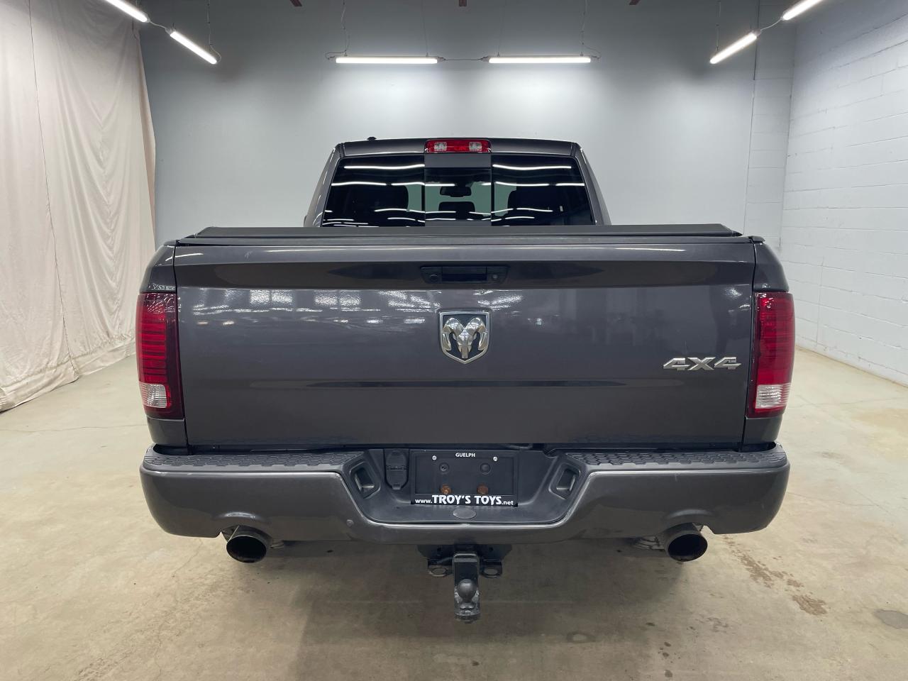 2014 RAM 1500 4WD QUAD CAB 140.5" SPORT Photo5