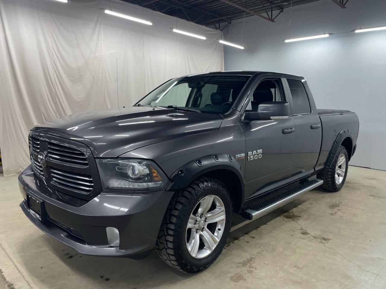 2014 RAM 1500 4WD QUAD CAB 140.5" SPORT