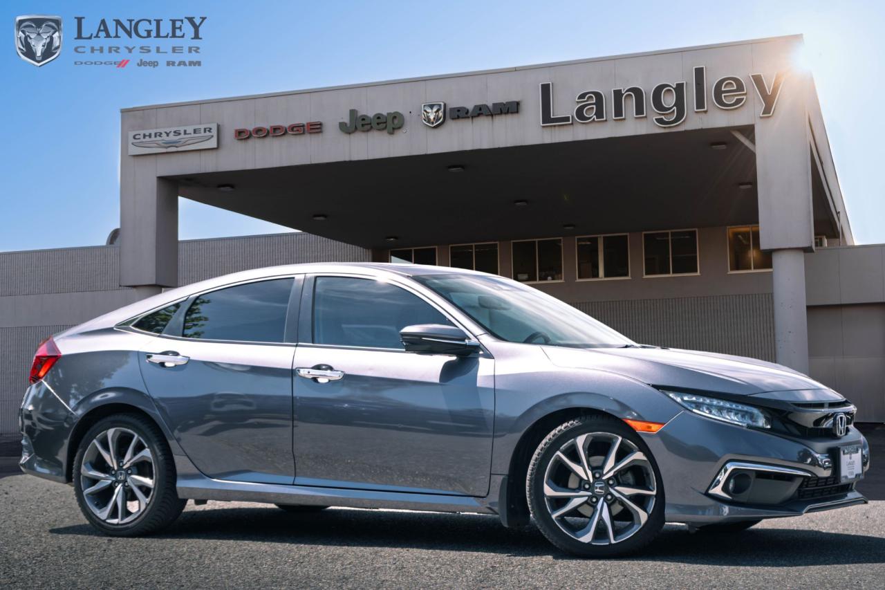 <p><span style=font-size:20px><strong>2020 Honda Civic Touring</strong></span></p>

<p><span style=font-size:20px>Stylish, efficient compact sedan.</span></p>

<ul>
 <li><span style=font-size:20px>1.5L Turbo 4-cylinder engine.</span></li>
 <li><span style=font-size:20px>Top-tier Touring trim.</span></li>
 <li><span style=font-size:20px>Advanced safety features.</span></li>
 <li><span style=font-size:20px>Comfortable, tech-rich interior.</span></li>
</ul>

<p><span style=font-size:20px>Come book a test drive at Langley Chrysler, Langley, BC.</span></p>

<p><span style=font-size:20px><strong>Scroll down for more options.</strong></span></p>
Dealer number: 5097, Doc fee: $968 Safety & Convince Warranty: $699 Finance Placement: $628

<p>*All prices plus applicable taxes, applicable environmental recovery charges, documentation of $599 and full tank of fuel surcharge of $76 if a full tank is chosen. <br />Other protection items available that are not included in the above price:<br />Tire & Rim Protection and Key fob insurance starting from $599<br />Service contracts (extended warranties) for coverage up to 7 years and 200,000 kms starting from $599<br />Custom vehicle accessory packages, mudflaps and deflectors, tire and rim packages, lift kits, exhaust kits and tonneau covers, canopies and much more that can be added to your payment at time of purchase<br />Undercoating, rust modules, and full protection packages starting from $199<br />Financing Fee of $500 when applicable<br />Flexible life, disability and critical illness insurances to protect portions of or the entire length of vehicle loan</p>
