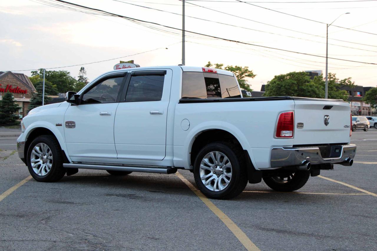 2013 RAM 1500 4WD Crew Cab 140.5" Laramie Longhorn Photo4