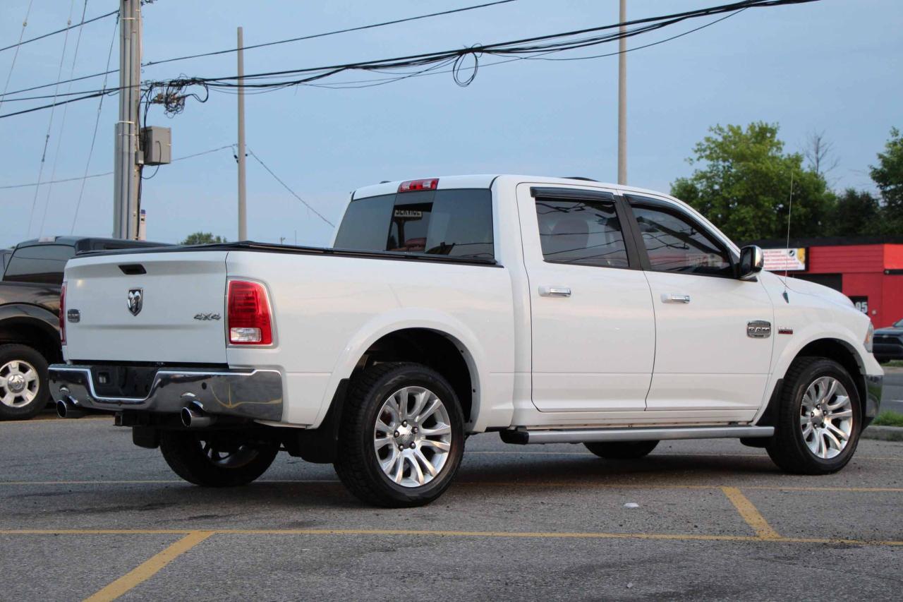 2013 RAM 1500 4WD Crew Cab 140.5" Laramie Longhorn - Photo #7