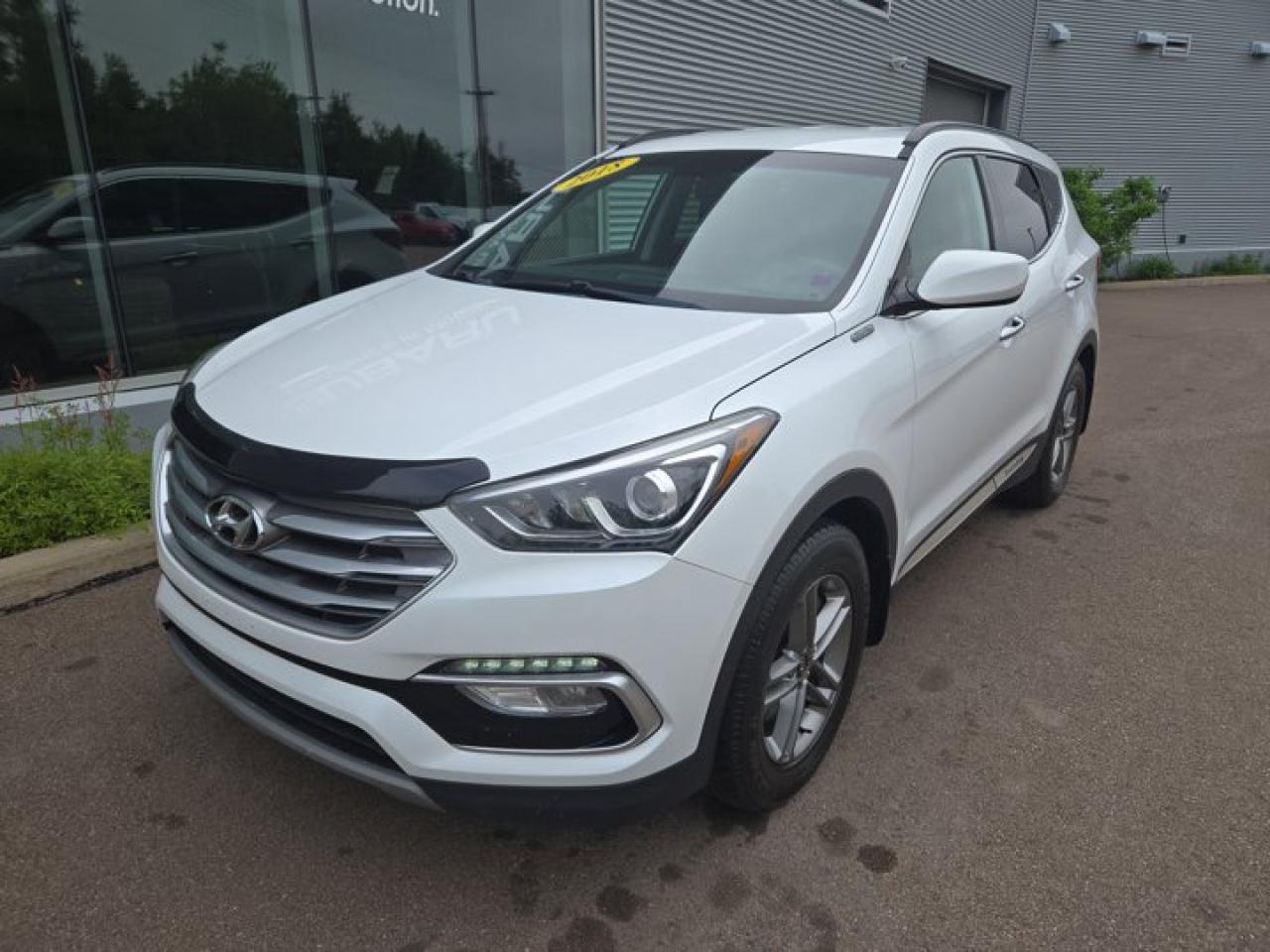 New Price!Odometer is 32977 kilometers below market average!The 2018 Hyundai Santa Fe Base: like your reliable uncle who wears cargo shorts year-roundmaybe not the flashiest, but always ready to haul your stuff, take the kids to soccer, and make terrible dad jokes along the way. Reliable, practical, and just enough horsepower to beat a shopping cart in a race.Frost White 2018 Hyundai Santa Fe Sport 2.4 Base FWD 6-Speed Automatic with Shiftronic 2.4L I4 DGI DOHCValue Market Pricing, No Accidents, ABS brakes, Air Conditioning, Alloy wheels, CD player, Exterior Parking Camera Rear, Front fog lights, Fully automatic headlights, Heated door mirrors, Heated front seats, Steering wheel mounted audio controls, Traction control, Variably intermittent wipers.Certification Program Details: 85 Point Inspection Fresh Oil Change Brake Inspection Tire Inspection Fresh 1 Year MVI Full Detail Free Carfax Report Full Tank of Gas Certified TechniciansFair Market Pricing * No Pressure Sales Environment * Access to over 2000 used vehicles * Free Carfax with every car * Our highly skilled and experienced team will ensure that your vehicle is in excellent condition and looking fantastic!!Steele Auto Group is the most diversified group of automobile dealerships in Atlantic Canada, with 34 dealerships selling 27 brands and an employee base of over 1000. Sales are up by double digits over last year and the plan going forward is to expand further into Atlantic Canada.