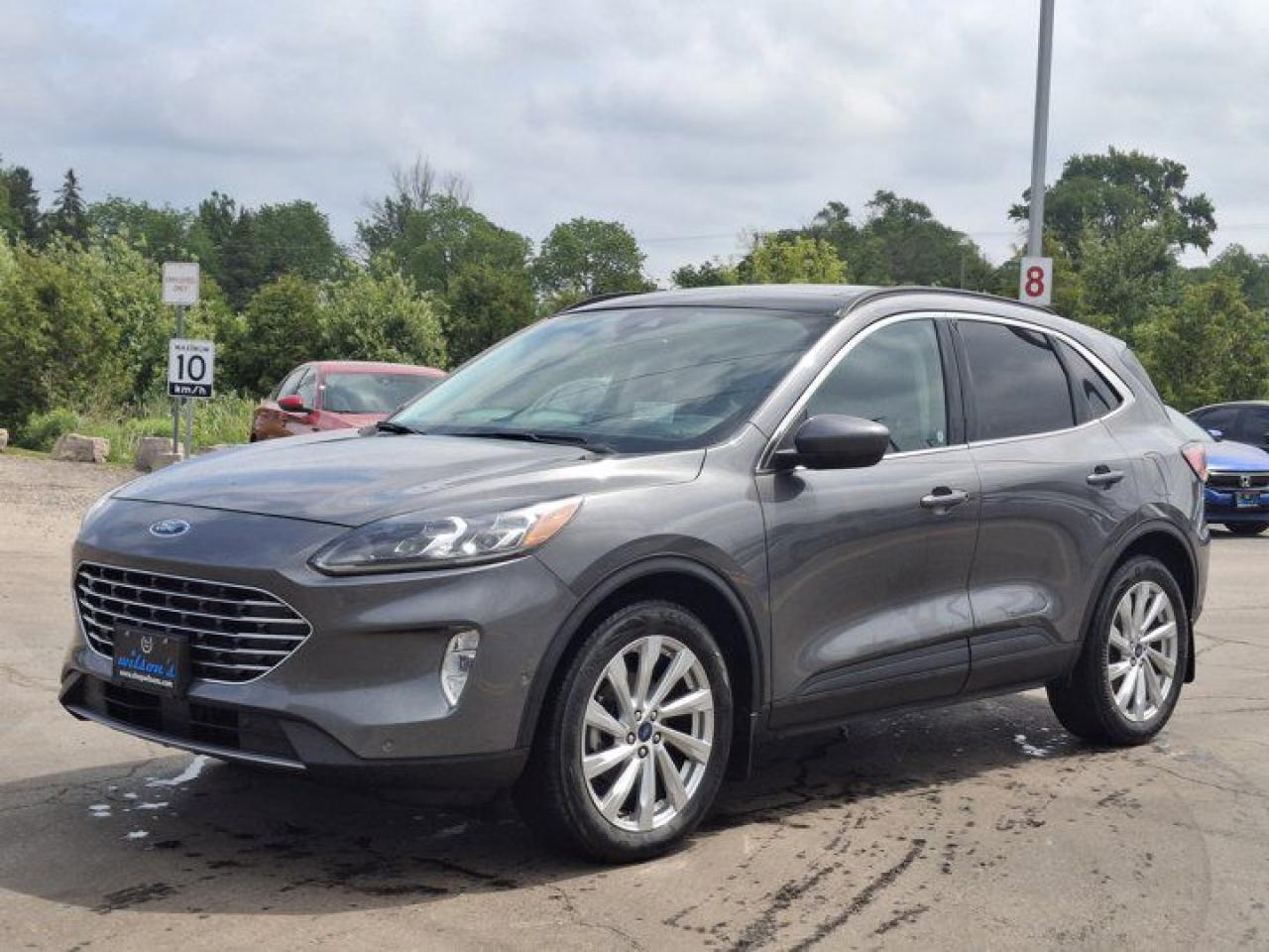Check out this certified 2021 Ford Escape Titanium Hybrid AWD | Pano Roof | Leather | Navi | Heated Seats + Steering | Remote Start & More !. Its Automatic transmission and 2.5 L engine will keep you going. This Ford Escape comes equipped with these options: Reverse Camera, Remote Start, Panoramic Roof, Navigation System, Leather, Heated Steering Wheel, Apple Car Play, Air Conditioning, Adaptive Cruise Control, and Heated Seats. Stop by and visit us at Mark Wilsons Better Used Cars, 5055 Whitelaw Road, Guelph, ON N1H 6J4.60+ years of World Class Service!500+ Live Market Priced VEHICLES! ONE MASSIVE LOCATION!Free Local Delivery Available!FINANCING! - Better than bank rates! 6 Months No Payments available on approved credit OAC. Zero Down Available. We have expert licensed credit specialists to secure the best possible rate for you and keep you on budget ! We are your financing broker, let us do all the leg work on your behalf! Click the RED Apply for Financing button to the right to get started or drop in today!BAD CREDIT APPROVED HERE! - You dont need perfect credit to get a vehicle loan at Mark Wilsons Better Used Cars! We have a dedicated licensed team of credit rebuilding experts on hand to help you get the car of your dreams!WE LOVE TRADE-INS! - Top dollar trade-in values!SELL us your car even if you dont buy ours! HISTORY: Free Carfax report included.Certification included! No shady fees for safety!EXTENDED WARRANTY: Available30 DAY WARRANTY INCLUDED: 30 Days, or 3,000 km (mechanical items only). No Claim Limit (abuse not covered)5 Day Exchange Privilege! *(Some conditions apply)CASH PRICES SHOWN: Excluding HST and Licensing Fees.2019 - 2024 vehicles may be daily rentals. Please inquire with your Salesperson.