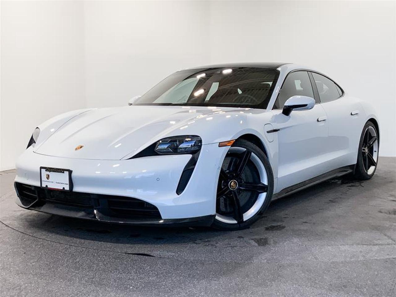 This Vehicle is Highly Equipped with Premium Package, Surround View Camera System, Porsche InnoDrive Including Adaptive Cruise Control, Storage Package, Porsche Intelligent Range Manager, Heat and Noise Insulating Glass, Lane Change Assist and much more! 2020 Porsche Taycan Turbo S comes in Carrara White Metallic with a Black and Bordeaux Red Leather Interior! This Vehicle has No Reported Accidents or Claims! This vehicle is a Porsche Approved Certified Pre-Owned Vehicle: 2 extra years of unlimited mileage warranty plus an additional 2 years of Porsche Roadside Assistance. All CPO vehicles have passed our rigorous 111-point check and reconditioned with 100% genuine Porsche parts. We Accept All Trade-Ins and Buy-Ins!! For more details or to schedule a test drive with one of our highly trained sales executives please call or send a website enquiry now before it is gone. Porsche Center Langley has won the prestigious Porsche Premier Dealer Award eight years in a row. We are centrally located just a short distance from Highway 1 in beautiful Langley, British Columbia. Our hope is to have you driving your dream vehicle soon. Please note that additional fees, including a $599 documentation fee & a $690 dealer prep fee, apply to all pre-owned vehicles. Dealer #40136