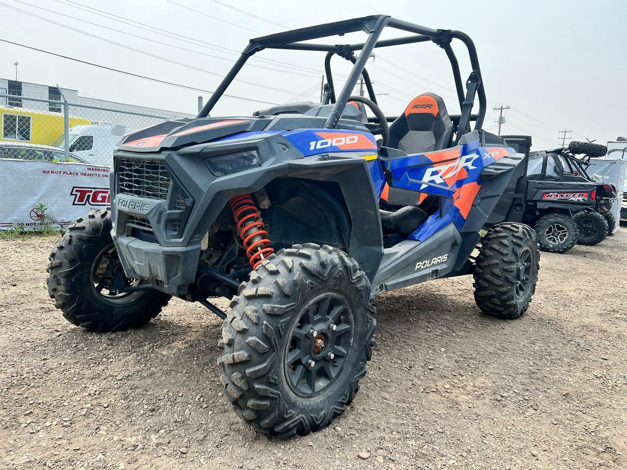 <p data-start=131 data-end=490>The 2022 Polaris RZR XP 1000 Sport is built to conquer rugged trails and open terrain with thrilling power, precision suspension, and proven off-road capability. Powered by a 110 HP ProStar 1000 engine, this machine delivers hard-hitting acceleration and smooth throttle response, whether youre blasting across desert flats or climbing steep, rocky inclines.</p><p data-start=131 data-end=490>&nbsp;</p><p data-start=492 data-end=900>Purpose-built for performance-minded riders, the XP 1000 Sport features Walker Evans Needle Shocks, a high-clearance dual A-arm suspension, and a long 90&rdquo; wheelbase for confident handling over rough terrain. With 29&rdquo; Maxxis Big Horn tires mounted on 14&rdquo; aluminum wheels, it tackles roots, ruts, and rocks with ease, while on-demand True AWD ensures you&rsquo;re always ready for whatever the trail throws your way.</p><p data-start=492 data-end=900>&nbsp;</p><p data-start=902 data-end=1188>This 2-seater also comes equipped with full doors, LED lighting, a durable poly roof, and bold RZR Sport graphics. Inside, you&rsquo;ll find bolstered bucket seats, a digital display with diagnostics, and a cockpit built for comfort and control during long, high-speed rides through the wild.</p><p data-start=162 data-end=254>&nbsp;</p><p data-start=1190 data-end=1366 data-is-last-node= data-is-only-node=>Call or message us today to learn more about financing, trade-ins, or delivery across Canada. The 2022 RZR XP 1000 Sport&mdash;ride harder, go farther, and leave the pavement behind.</p>