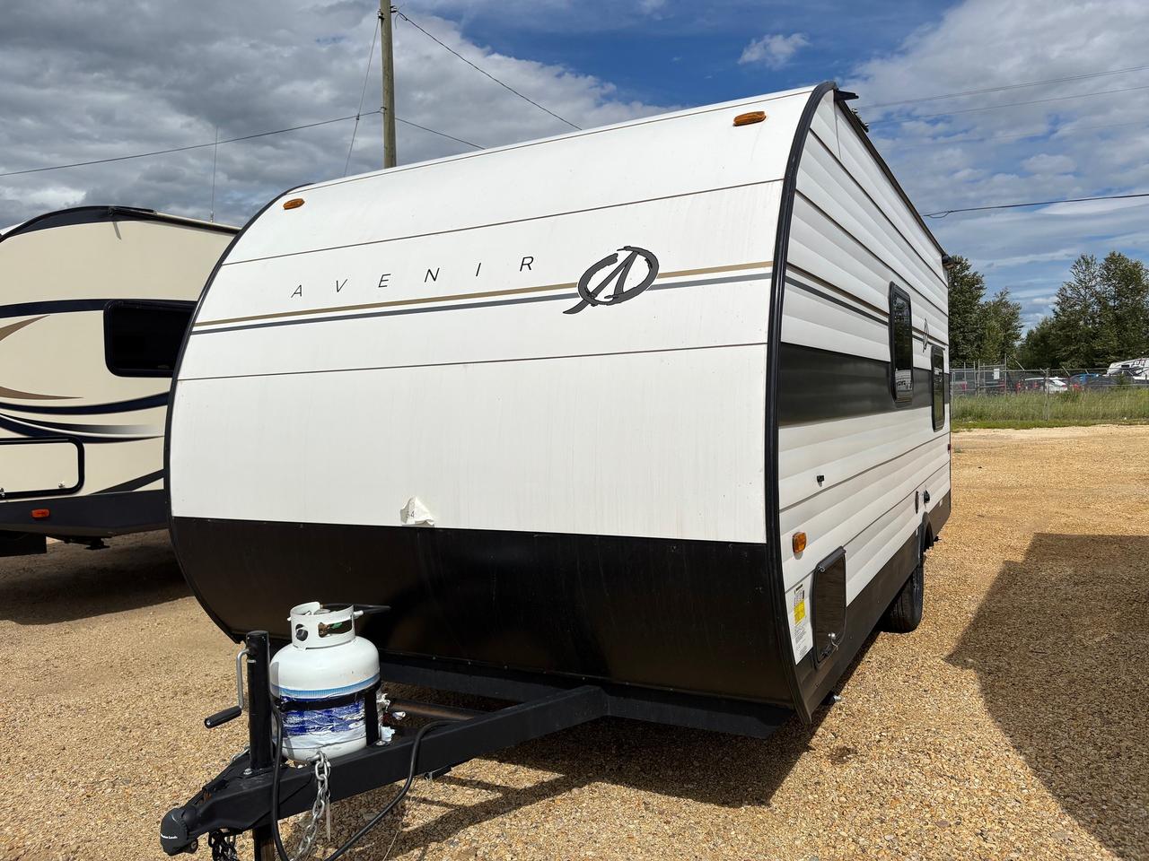 <p data-start=116 data-end=499><span style=font-size: 18pt;><strong>The 2025 Avenir 17BH</strong> </span></p><p data-start=116 data-end=499>is the perfect lightweight travel trailer for small families or couples looking for adventure. Measuring just over 21 feet in length and 9&rsquo;5&rdquo; in height, this single-axle trailer is easy to tow while still offering plenty of comfort. With a dry weight of only 2,922 lbs and a GVWR of 3,894 lbs, it&rsquo;s built for effortless travel without sacrificing strength.</p><p data-start=501 data-end=785>Inside, the Avenir 17BH comfortably sleeps up to four and features practical amenities including a 12V 3.3 cu. ft. refrigerator, a cozy fireplace, LED lighting, a gas water heater, and a range with a 2-burner cooktop. A 20 lb propane tank adds to its convenience for extended trips.</p><p data-start=787 data-end=1035>You&rsquo;ll have all the holding capacity you need with <strong data-start=838 data-end=867>40 gallons of fresh water</strong>, <strong data-start=869 data-end=897>30 gallons of grey water</strong>, and <strong data-start=903 data-end=932>30 gallons of black water</strong>. Climate control is handled by an <strong data-start=967 data-end=984>8,000 BTU A/C</strong> system, keeping you comfortable wherever you go.</p><p data-start=1037 data-end=1306>On the exterior, you&rsquo;ll find durable touches like a diamond plate stone guard, heavy-duty smooth corrugated metal siding, radial tires, and stabilizer jacks for secure setup. The power awning with LED lighting and arm adjustment adds the perfect outdoor living space.</p><p data-start=1308 data-end=1443>Compact yet spacious, stylish yet rugged, the <strong data-start=1354 data-end=1374>2025 Avenir 17BH</strong> is designed to give you everything you need for your next getaway.</p><p>&nbsp;</p>