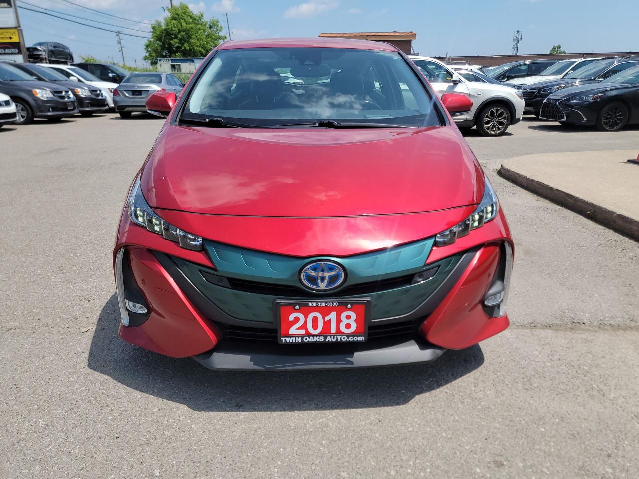 <p data-start=91 data-end=174><strong data-start=91 data-end=174>2018 Toyota Prius Prime Upgrade – Ultra-Efficient, Tech-Loaded, and Super Clean</strong></p><p data-start=176 data-end=485>Looking for a hybrid that delivers incredible fuel savings without sacrificing comfort or tech? This <strong data-start=277 data-end=312>2018 Toyota Prius Prime Upgrade</strong> is the perfect fit. With <strong data-start=338 data-end=356>low kilometers</strong>, a spotless interior and exterior, and Toyota’s proven hybrid reliability, this plug-in is ready for years of efficient driving.</p><p data-start=487 data-end=504><strong data-start=487 data-end=504>Key Features:</strong></p><ul data-start=506 data-end=1178><li data-start=506 data-end=587><p data-start=508 data-end=587>Plug-in Hybrid Electric Vehicle (PHEV) – up to <strong data-start=555 data-end=587>40 km of electric-only range</strong></p></li><li data-start=588 data-end=659><p data-start=590 data-end=659>Incredible combined fuel efficiency: <strong data-start=627 data-end=642>1.8Le/100km</strong> (electric + gas)</p></li><li data-start=660 data-end=707><p data-start=662 data-end=707><strong data-start=662 data-end=684>Heated front seats</strong> for year-round comfort</p></li><li data-start=708 data-end=759><p data-start=710 data-end=759><strong data-start=710 data-end=743>11.6-inch touchscreen display</strong> with navigation</p></li><li data-start=760 data-end=806><p data-start=762 data-end=806><strong data-start=762 data-end=793>Apple CarPlay and Bluetooth</strong> connectivity</p></li><li data-start=807 data-end=845><p data-start=809 data-end=845><strong data-start=809 data-end=845>Smart Key with Push Button Start</strong></p></li><li data-start=846 data-end=905><p data-start=848 data-end=905><strong data-start=848 data-end=865>Backup camera</strong> and blind spot monitor for added safety</p></li><li data-start=906 data-end=1063><p data-start=908 data-end=1063><strong data-start=908 data-end=933>Toyota Safety Sense P</strong>: includes Pre-Collision System, Lane Departure Alert with Steering Assist, Dynamic Radar Cruise Control, and Automatic High Beams</p></li><li data-start=1064 data-end=1099><p data-start=1066 data-end=1099><strong data-start=1066 data-end=1099>LED headlights and taillights</strong></p></li><li data-start=1100 data-end=1126><p data-start=1102 data-end=1126><strong data-start=1102 data-end=1126>17-inch alloy wheels</strong></p></li><li data-start=1127 data-end=1178><p data-start=1129 data-end=1178>Split-folding rear seats for flexible cargo space</p></li></ul><p data-start=1180 data-end=1435>This Prius Prime Upgrade is <strong data-start=1208 data-end=1223>super clean</strong>, locally driven, and comes with <strong data-start=1256 data-end=1281>great kms</strong>. Whether youre commuting or heading out for a road trip, it delivers outstanding efficiency, advanced safety, and premium features in one smart package.</p><p><strong>Additional Certification Cost</strong>: The full certification cost for this vehicle is <strong>$790 + HST</strong>.</p><p><strong>What’s Included with Certification</strong>:</p><ul><li>The vehicle will be delivered with a <strong>valid safety certification</strong> and a <strong>36-day safety item warranty</strong> for your peace of mind.</li><li>A <strong>fresh oil change</strong> will be performed, and all fluids will be topped up.</li><li>The vehicle will be <strong>professionally detailed</strong>, ensuring it looks and feels like new when you pick it up.</li></ul><p>At <strong>Twin Oaks Auto</strong>, we are committed to providing a <strong>hassle-free car buying experience</strong>. From your first inquiry to driving off in your new car, our goal is to get you on the road quickly and stress-free!</p><p><strong>Financing Options Available!</strong><br />Flexible financing options are available to suit your needs. Contact us for more details.</p><p><strong>Contact Us Today</strong>:<br />📞 <strong>Call Us</strong>: 905-339-3330<br />📍 <strong>Location</strong>: 2470 Royal Windsor Drive, Oakville, Ontario, L6J 7Y2</p><p><br />(Conveniently located between Ford Drive and Winston Churchill Blvd.)</p><p><strong>More Information</strong>:<br />Visit our website at <strong><a href=http://www.twinoaksauto.com>TwinOaksAuto.com</a></strong> to view additional pictures, explore our inventory, and access CARFAX reports.</p><p> </p>