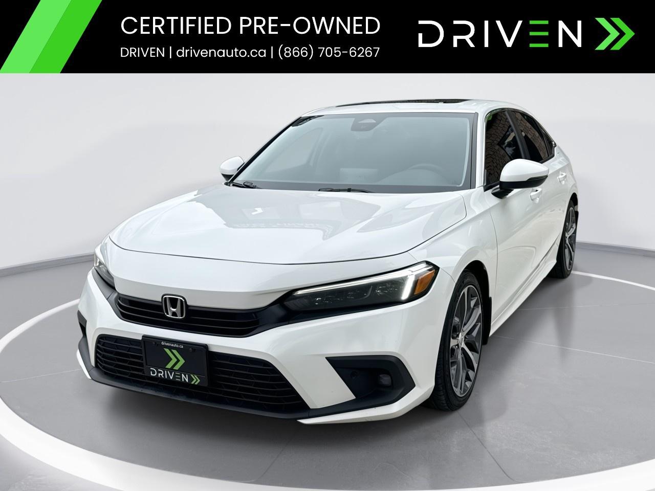 <p>The 2022 Honda Civic Sedan Touring in stunning white with front-wheel drive offers a refined driving experience with its responsive handling. Perfectly designed for those who appreciate both style and performance, this sedan presents a sleek silhouette complemented by its alloy wheels.</p><p>Inside, the cabin greets you with a sophisticated black interior and luxurious leather seats, providing a premium feel. The sunroof/moonroof adds an open-air vibe to your ride, while passengers enjoy optimal comfort with heated front and rear seats.</p><p>Equipped with state-of-the-art technology, this Civic Sedan features a navigation system, a backup camera, and advanced safety technologies like lane assist and brake assist for confident driving. Whether it's the smart device integration, Wi-Fi hotspot, satellite radio, or the convenience of adaptive cruise control and keyless entry, the car ensures a seamless journey.</p><p>This vehicle is ideal for those seeking reliability and innovation in a stylish package. Contact our dealership today to learn more about this exceptional Honda Civic Touring and schedule your test drive.</p> <p><strong>Why Buy from DRIVEN?</strong></p><p>At <strong>DRIVEN</strong>, we're <strong>Ontarios Premier Dealership</strong>, committed to making your car-buying experience <strong>easy, transparent, and stress-free</strong>. Unlike other dealers who sneak in extra fees for certification, our pricing is <strong>all-inclusive</strong>no hidden fees, just <strong>sales tax and licensing</strong>.</p><p>Every vehicle comes with a <strong>complimentary Carfax history report</strong> and has passed a <strong>rigorous 150-point inspection</strong> and <strong>reconditioning</strong> process at our state-of-the-art service facility. We dont just meet minimum safety standardswe <strong>exceed them</strong>, including a <strong>fresh oil change</strong> and ensuring all <strong>service requirements are up to date</strong>. Plus, for <strong>added peace of mind</strong>, every vehicle is backed by our <strong>30-Day / 2,500 KM Assurance Program</strong>.</p><p>Looking to trade in? <strong>We get you top dollar</strong> by exposing your vehicle to online auctions across Canada.</p><p>Not buying from us? <strong>No problemwell still buy your car!</strong></p><p>But dont just take our word for itour <strong>Glowing 5-star Google Reviews</strong> speak for themselves. See why so many customers trust us to help them find the perfect car!</p><p><strong>>> Advertised Price Reflects a $2,000 Finance Credit. Cash Price May Vary. <<</strong></p>