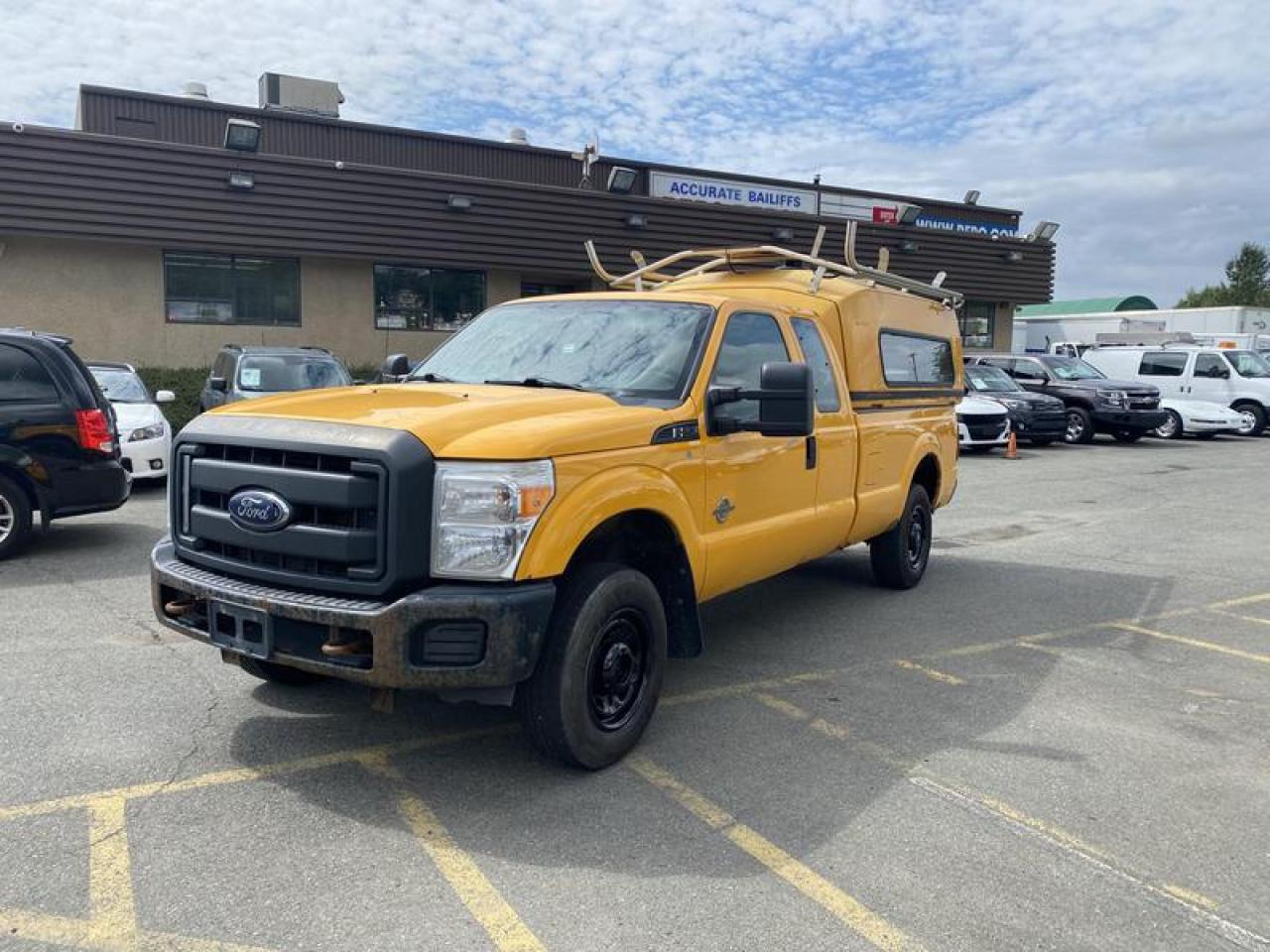 Used 2013 Ford F-250 SD XLT SuperCab Long Bed 4WD Diesel with work top canopy for sale in Burnaby, BC