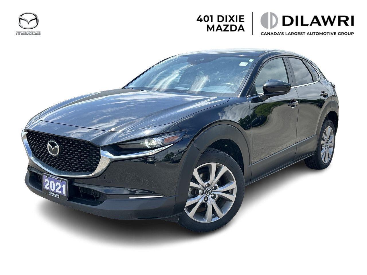 Experience refined driving in the 2021 Mazda CX-30 GT, a top-tier compact SUV that combines elegance, versatility, and advanced technology. Powered by a responsive 2.5L Skyactiv-G engine with 186 horsepower and equipped with i-Activ all-wheel drive, it delivers confident performance in all road conditions. The GT trim offers a luxurious interior featuring leather-trimmed seats, a power-adjustable drivers seat with memory function, dual-zone automatic climate control, and heated front seats for enhanced comfort. Stay connected with the 8.8-inch Mazda Connect infotainment system, Apple CarPlay and Android Auto, and enjoy superior sound quality through the 12-speaker Bose premium audio system. With advanced safety features like Smart City Brake Support, blind-spot monitoring, adaptive cruise control, and lane-keep assist, the 2021 CX-30 GT is designed to keep you safe while delivering an upscale driving experience.



___________________________________________________________________________________________________________

Experience worry-free car ownership when you purchase a Dilawri Certified Pre-Owned Vehicle from 401 Dixie Mazda, you will be entitled to exclusive benefits such as...

105 point safety and quality inspection.

Inspected and serviced by factory-trained technicians.

3 days or 300km exchange policy **

Powertrain Warranty 90 days or 3000km**

Complimentary roadside assistance for 1 year up to 50kms 

___________________________________________________________________________________________________________

401 Dixie Mazda has been proudly serving in Mississauga, Brampton, Oakville, Milton, Burlington, Hamilton, Guelph, Kitchener, Waterloo, Newmarket, Aurora, Barrie, Scarborough, Markham, Richmond hill, Toronto, Ajax, Pickering, Oshawa and Windsor through the Dilawri Group. No hidden costs or fees.

___________________________________________________________________________________________________________

Privately owned and operated by the Dilawri family since 1985, Dilawri continues to build on a history of excellence as Canadas largest automotive group. The companys network represents 37 of the worlds most beloved automotive brands at 80 franchised dealerships in Canada and the US. Dilawri is a 2023 winner of the Canadas Best Managed Companies program, which recognizes excellence in private Canadian-owned companies.


Dilawri is proud to offer exceptional products and services, delivered by our more than 3,500 employees. We are committed to leadership in business as well as in the communities we serve. Since 2002, the Dilawri Foundation has contributed millions of dollars to a wide range of charitable causes.


While we make every effort to provide you with two keys for all our pre-owned vehicles. However, unless otherwise specified in your purchase agreement.


Price online reflects a $1000 Finance Credit applied. Cash Price will differ.