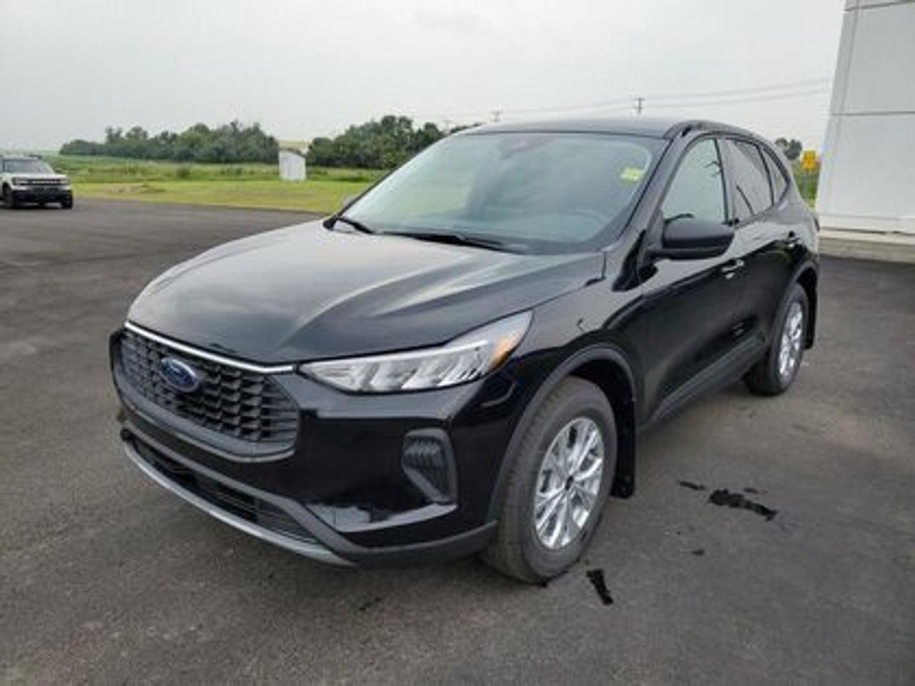 This all-new 2025 Escape Active 200A looks absolutely stunning in Agate Black Metallic. This 5-passenger All-wheel drive crossover comes equipped with the 1.5L EcoBoost® engine. This remarkable engine not only produces 181 horsepower and 190 ft-lbs of torque, but by leveraging EcoBoost® technology and an 8-speed automatic transmission, this crossover is rated to get an estimated 8.4L/100km (34 miles per gallon) combined highway/city fuel economy.

Key Features:
8 Instrument panel cluster
 All-wheel drive
Ford Co-Pilot360
Heated Front Seats
Remote Start
Heated Mirrors
SYNC® 4 W/8 LCD Capacitive Touchscreen
Wireless Apple CarPlay® and Android Auto Compatibility
Privacy Glass
17 Shadow Silver Painted Aluminum Wheels
Power Windows
LED Taillamps
LED Headlamps
FordPass Connect
Mini Spare Wheel/Tire

Moose Jaw Ford, conveniently located at 1010 North Service Road in Moose Jaw, is your trusted destination for all your automotive needs. With an impressive 4.8-star Google rating from nearly 1,500 reviews, we are proud to deliver an exceptional vehicle-buying experience tailored just for you. Our Moose Jaw Motives set us apart, offering unbeatable value like half-priced oil changes for life on pre-owned vehicles, one year of key and remote protection, and one year of tire and rim protection. Enjoy peace of mind with every purchase. At Moose Jaw Ford, were committed to driving positive change in our community by combining exceptional service, high-quality vehicles, and a guest-first approach. Visit us today!