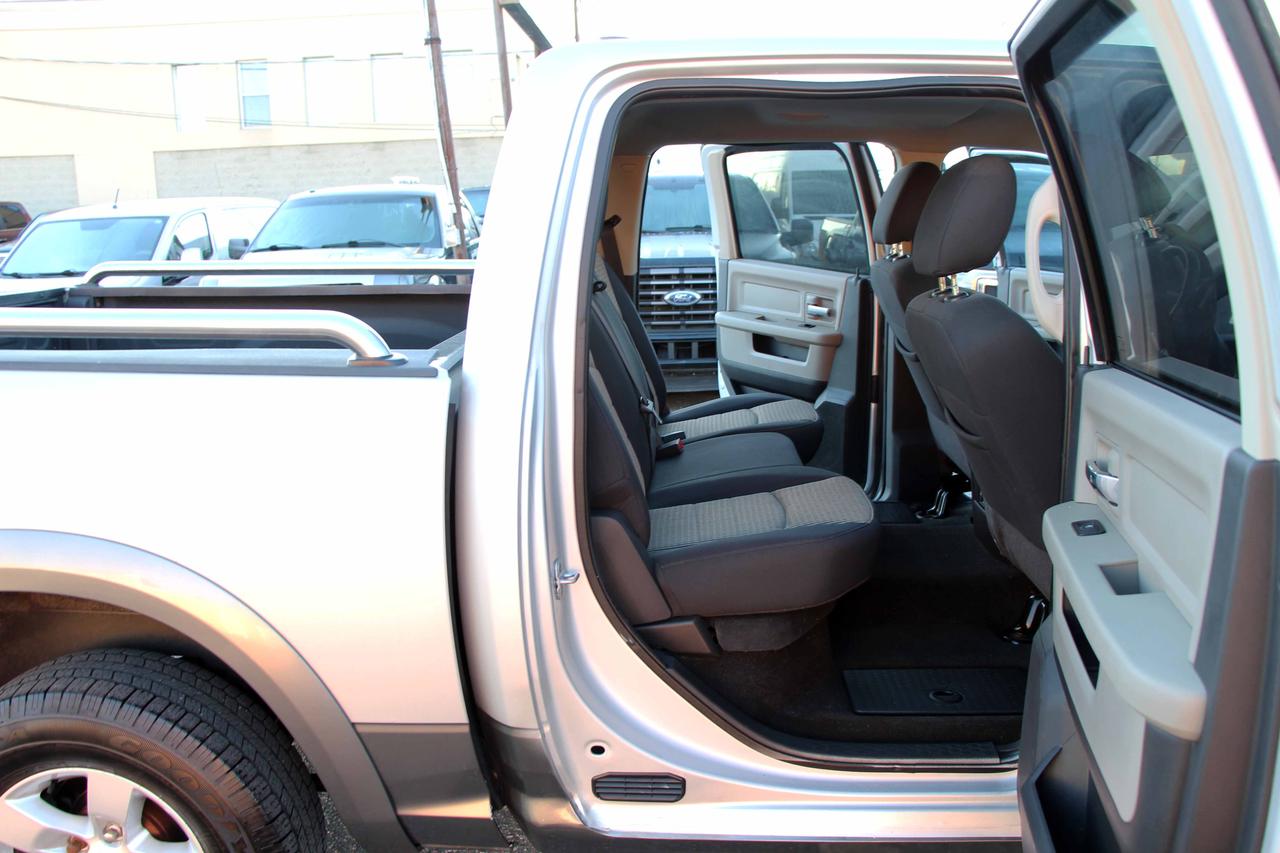 2012 RAM 1500 4WD CREW CAB 140.5" OUTDOORSMAN Photo