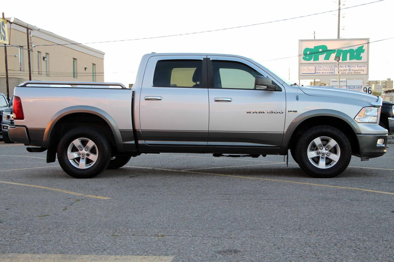 2012 RAM 1500 4WD CREW CAB 140.5" OUTDOORSMAN Photo
