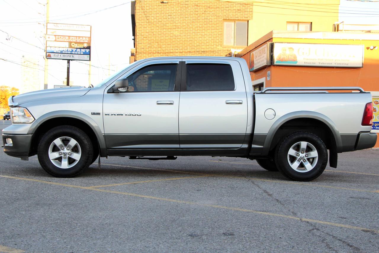 2012 RAM 1500 4WD CREW CAB 140.5" OUTDOORSMAN Photo